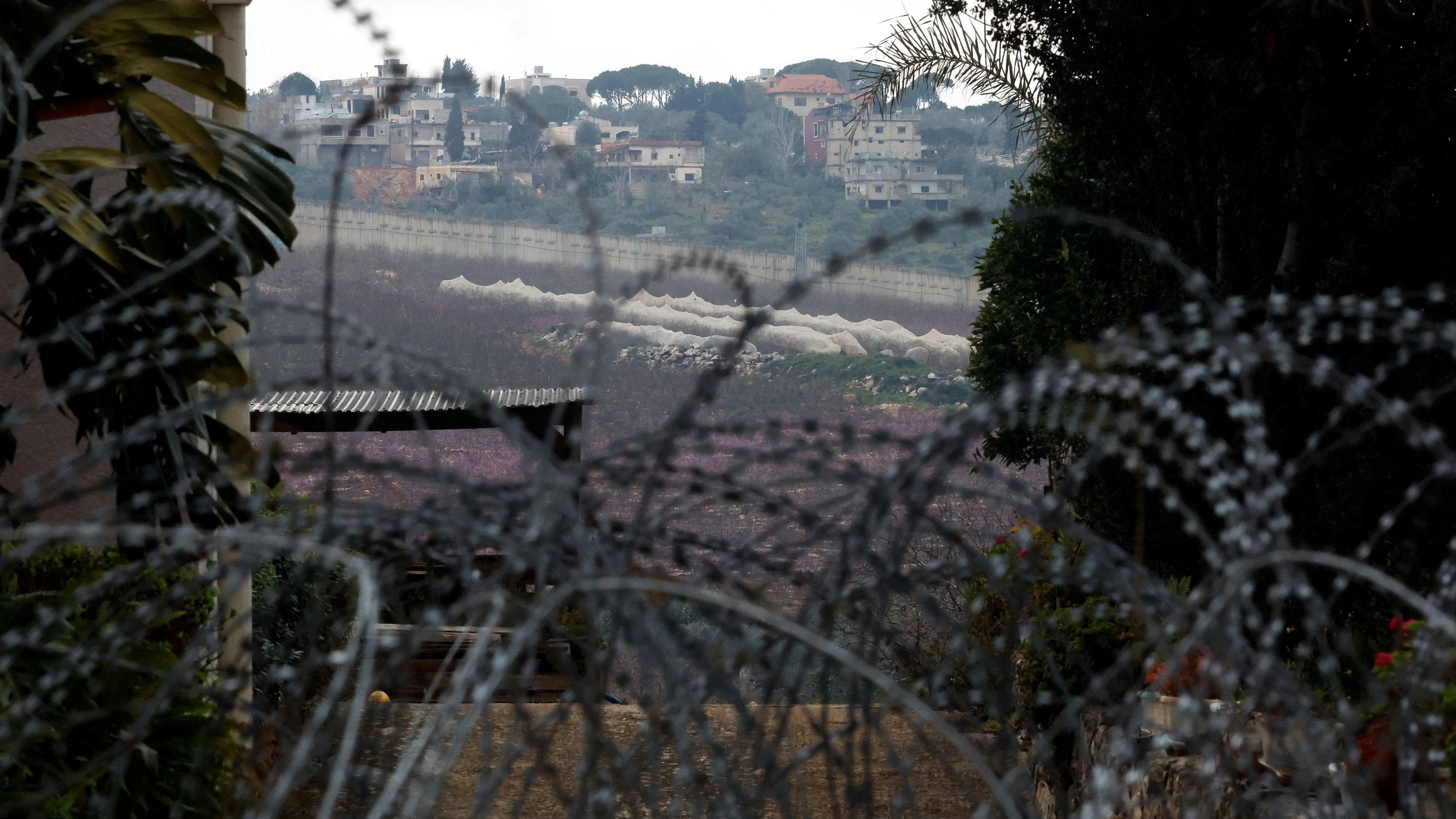 <div class="paragraphs"><p>Razor wire lies near an abandoned house, amid ongoing cross-border hostilities between Hezbollah and Israeli forces, near Israel’s border with Lebanon in northern Israel, March 19, 2024. </p></div>