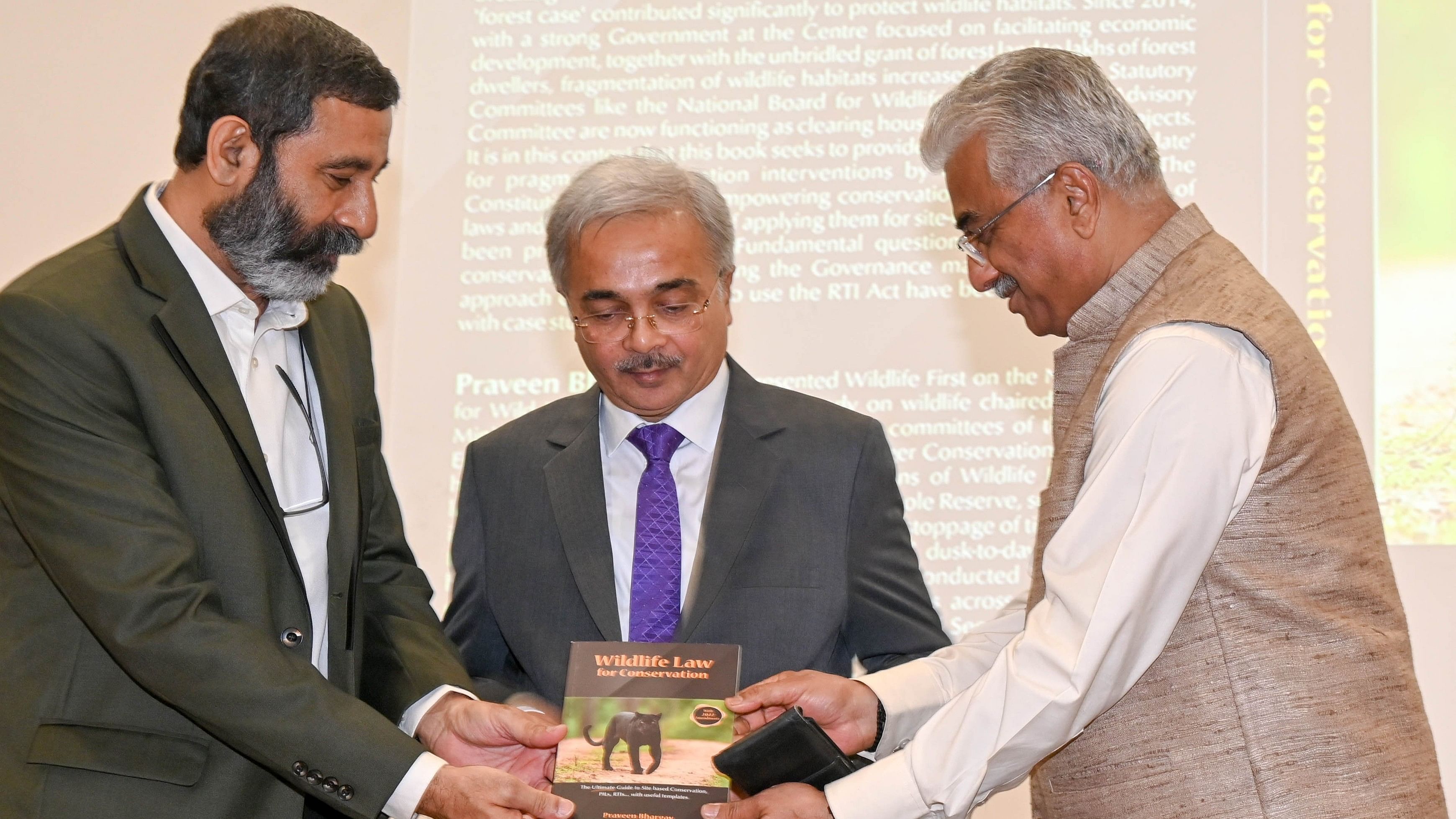 <div class="paragraphs"><p>Supreme Court Judge Justice Aravind Kumar (extreme right) gives a copy of the book to author Praveen Bhargav (extreme left) at the Karnataka Judicial Academy in Bengaluru on Monday. Chief Justice of Karnataka Nilay Vipinchandra Anjaria also seen. </p></div>