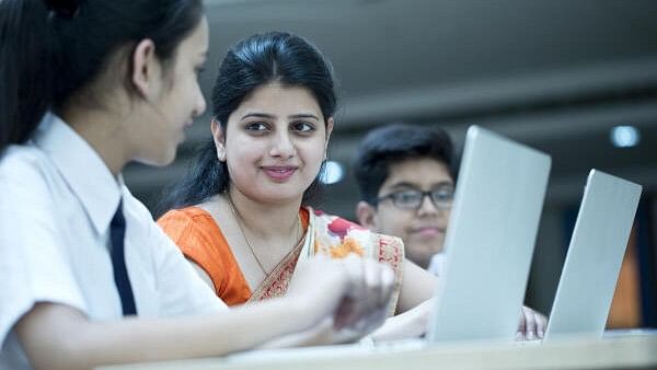 <div class="paragraphs"><p>Teacher interacting with students. Representative image.</p></div>