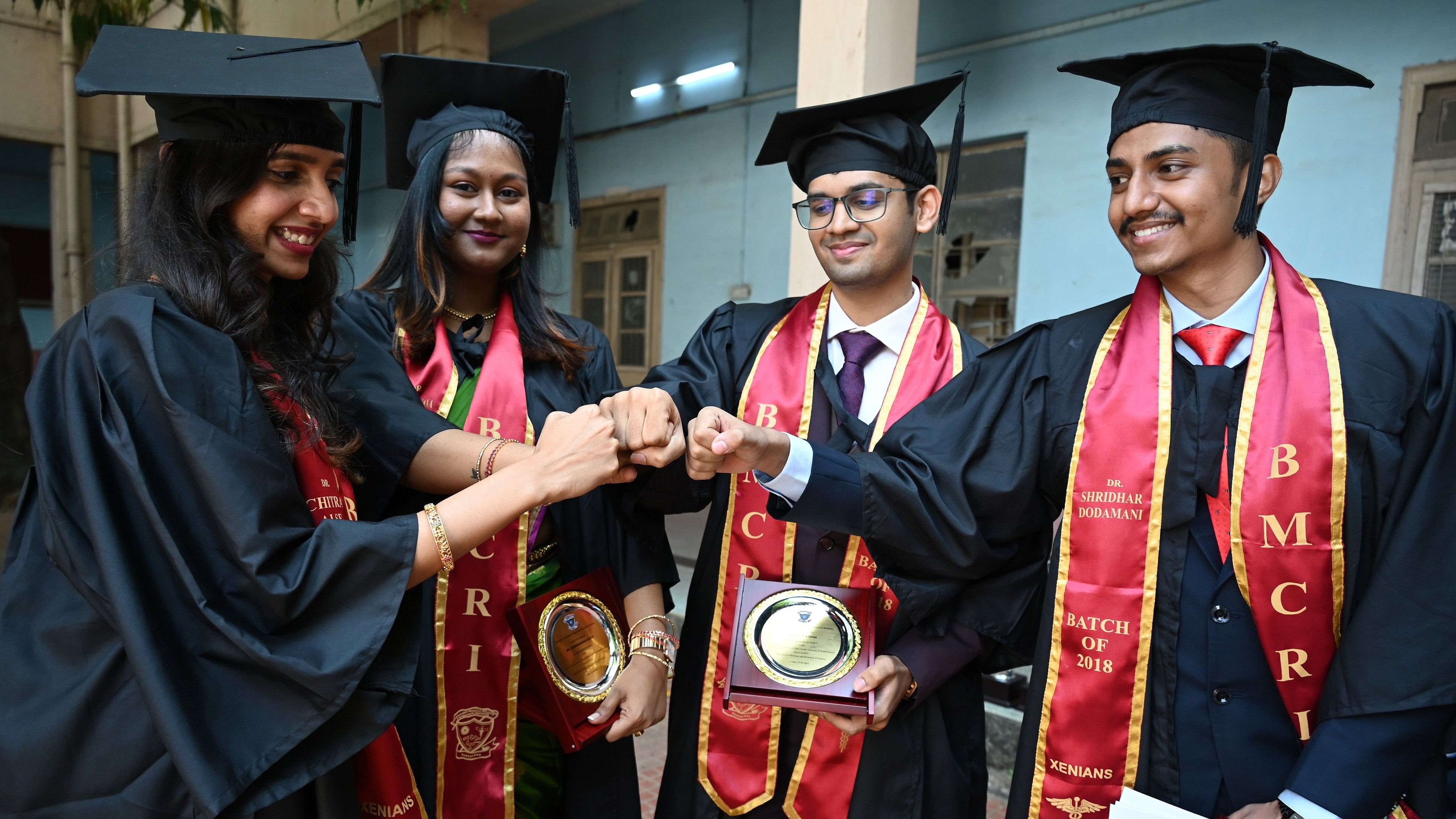 <div class="paragraphs"><p>(L-R) Chitra Alseis, recipient of RGUHS gold medal for scoring highest in Pharmacology; Chadranana Sahoo, third rank in RGUHS; Pratik A Shah, second rank in RGUHS; and Shridhar Doddamani ninth rank in RGUHS during the convocation on Friday. </p></div>