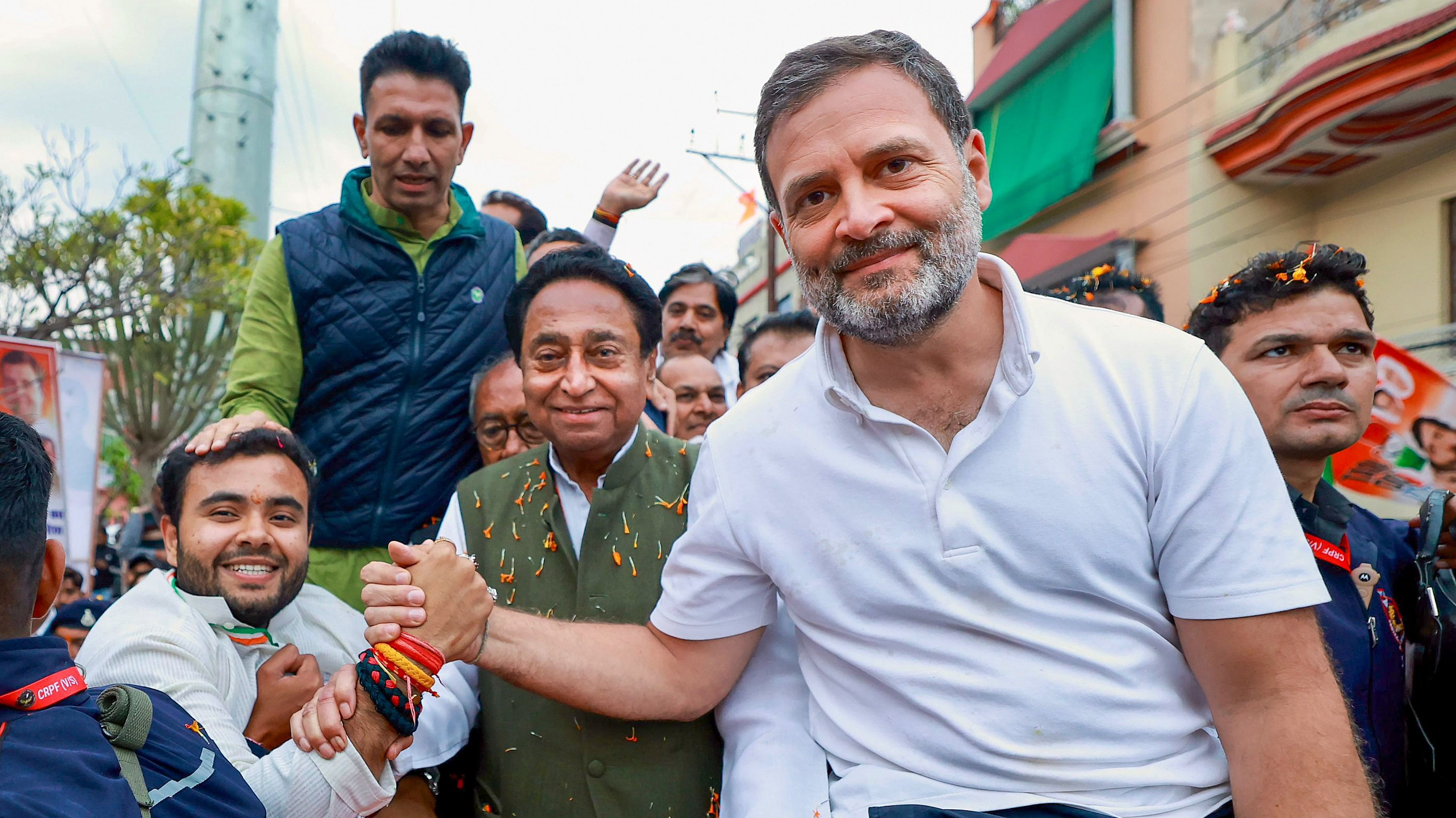 <div class="paragraphs"><p>Congress leader Rahul Gandhi with Madhya Pradesh state party President Jitendra Patwari, party leader Kamal Nath and others greets a supporter at a roadshow during the ‘Bharat Jodo Nyay Yatra’, in Madhya Pradesh, on Saturday.</p></div>