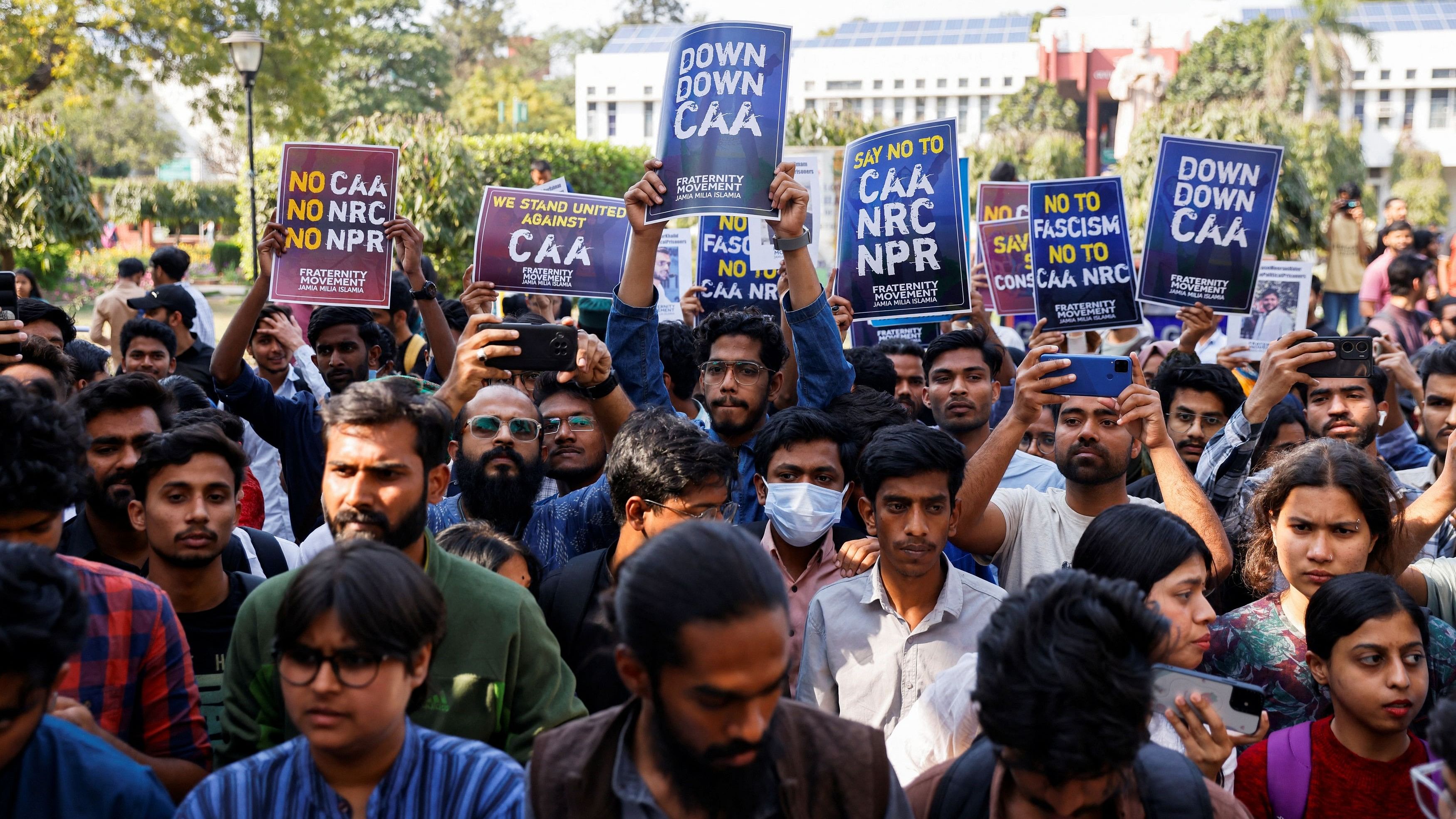<div class="paragraphs"><p>Students of Jamia Millia Islamia University from different student organizations hold placards against a citizenship law during a press conference held inside the university in New Delhi on Tuesday.</p></div>