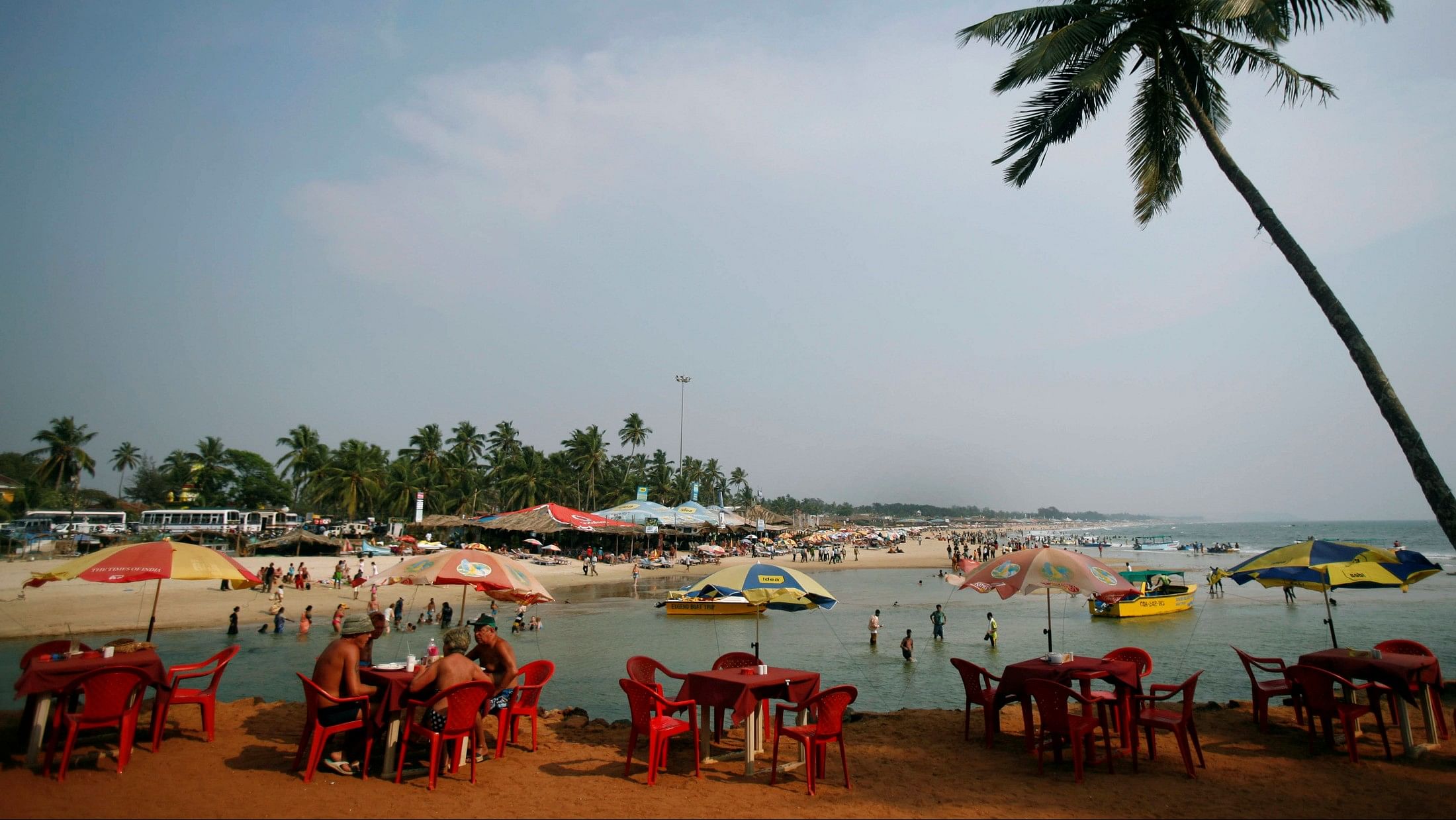 <div class="paragraphs"><p>In this file photo, tourists relax Baga beach in Goa </p></div>