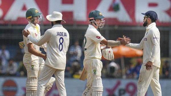 <div class="paragraphs"><p>Australian players being greeted by Indian players after a test match win.</p></div>