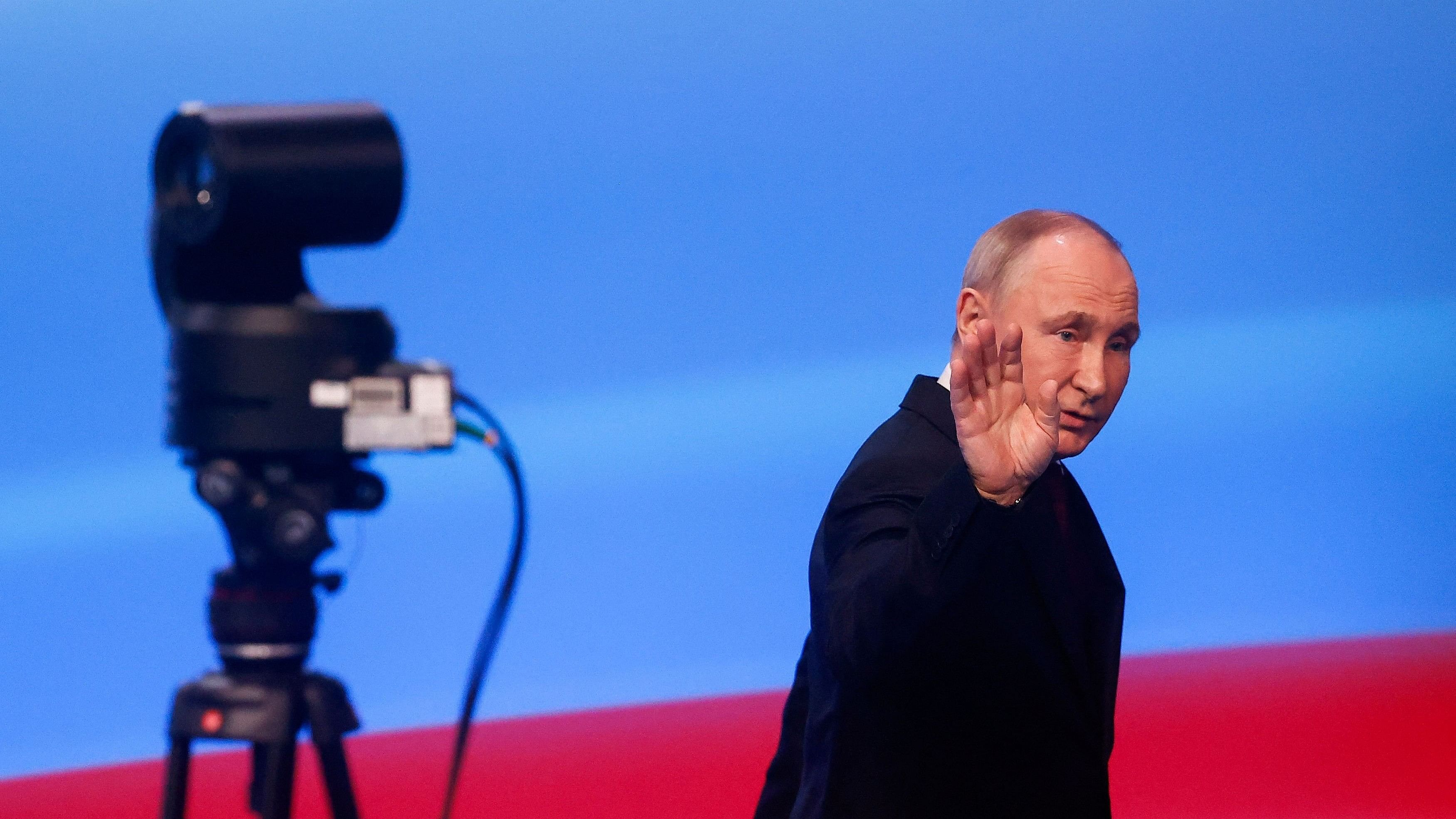 <div class="paragraphs"><p>Russian presidential candidate and incumbent President Vladimir Putin gestures as he leaves following his speech after polling stations closed, in Moscow, Russia, March 18, 2024. </p></div>