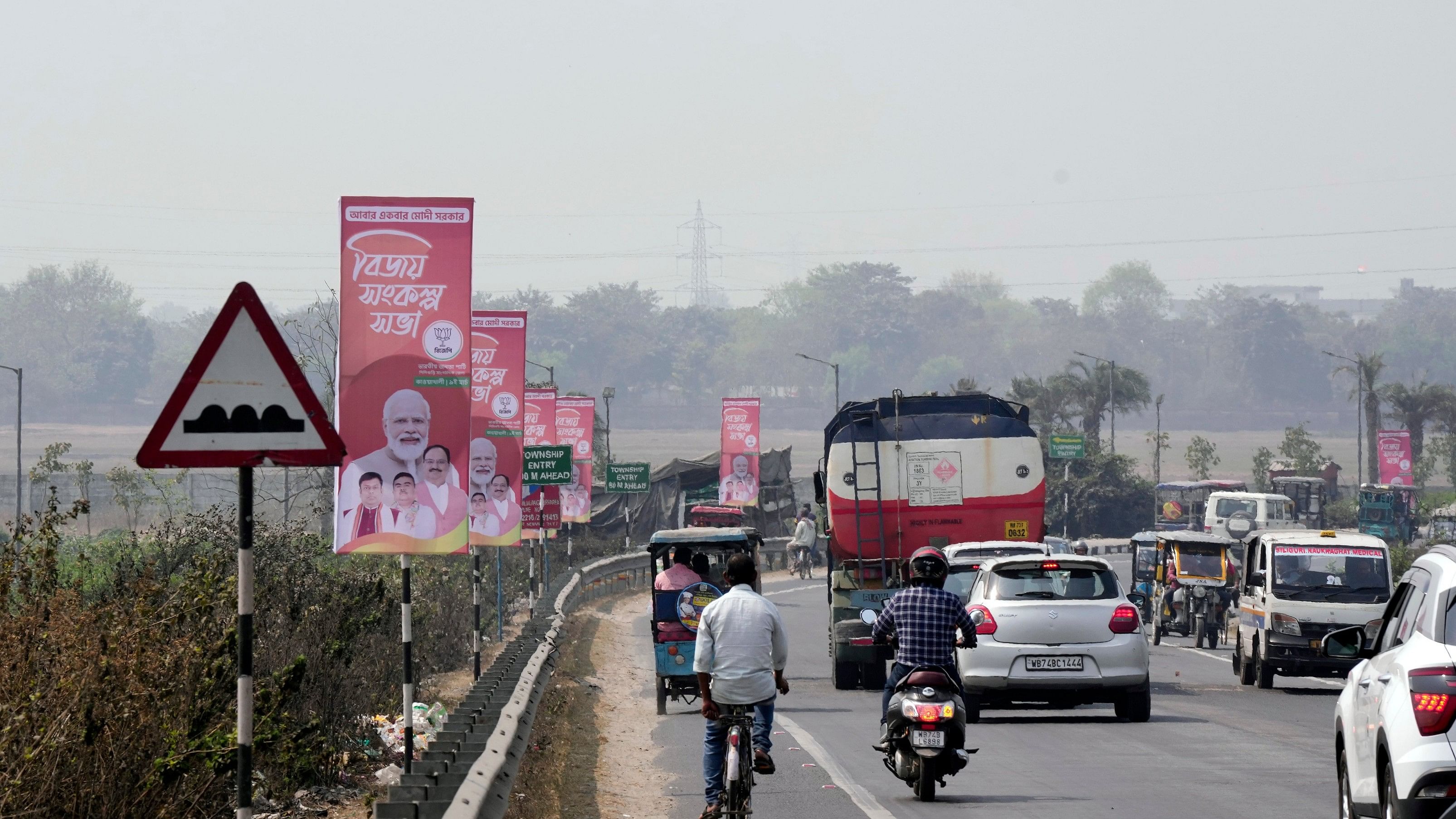 <div class="paragraphs"><p>File photo showing posters installed along a road ahead of Prime Minister Narendra Modi's visit, in Siliguri, on March 8, 2024. </p></div>