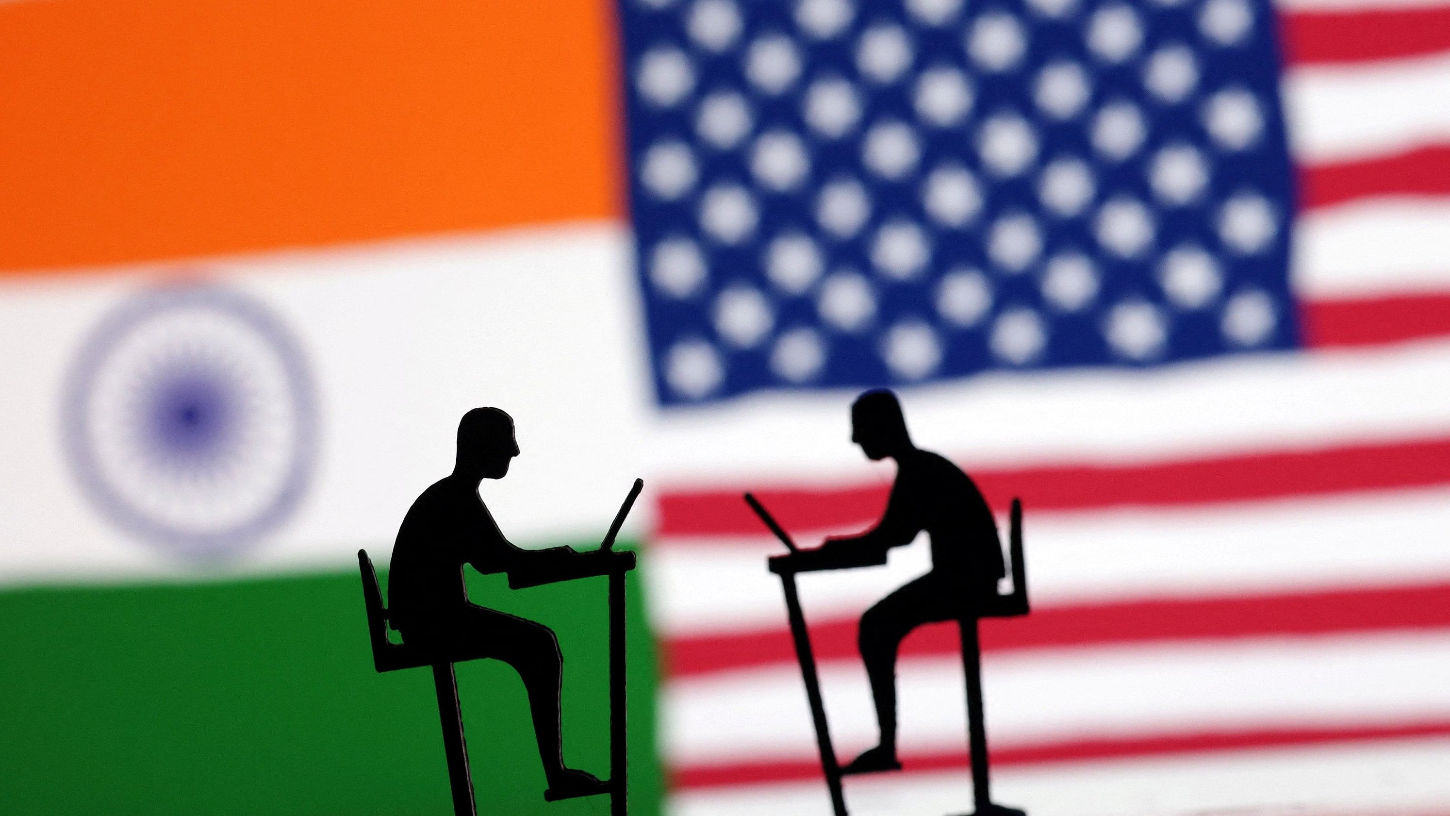 <div class="paragraphs"><p>The Indian flag, the US flag and people miniatures with laptops are seen in this illustration taken March 10, 2024. </p></div>