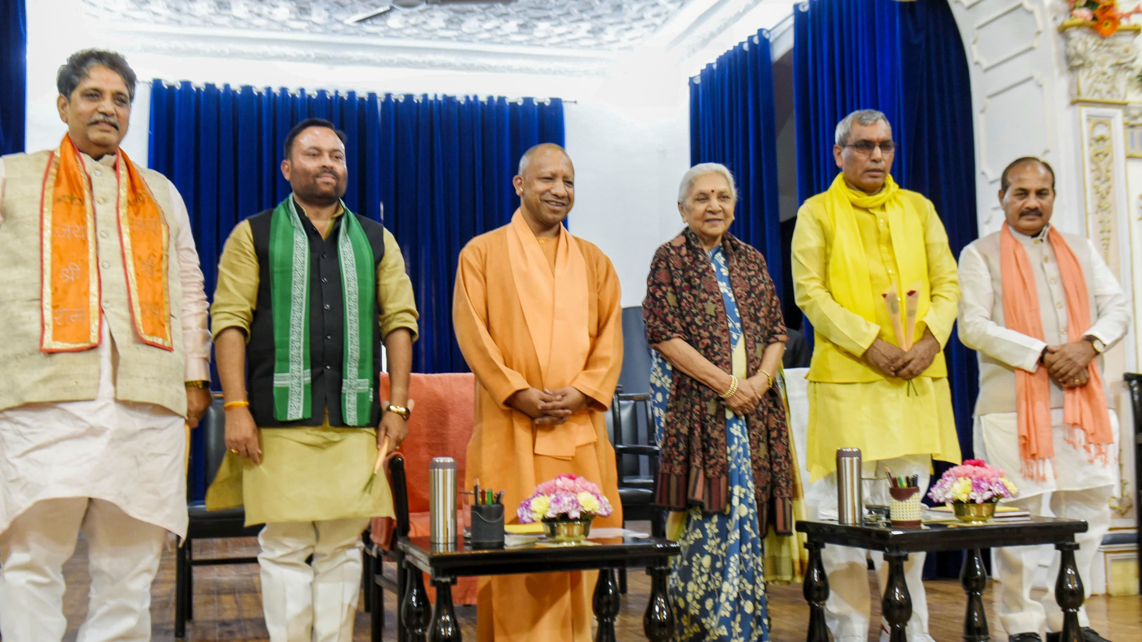 <div class="paragraphs"><p>Uttar Pradesh Governor Anandiben Patel with Chief Minister Yogi Adityanath and newly sworn-in cabinet ministers at Raj Bhavan, in Lucknow, on Tuesday.</p></div>