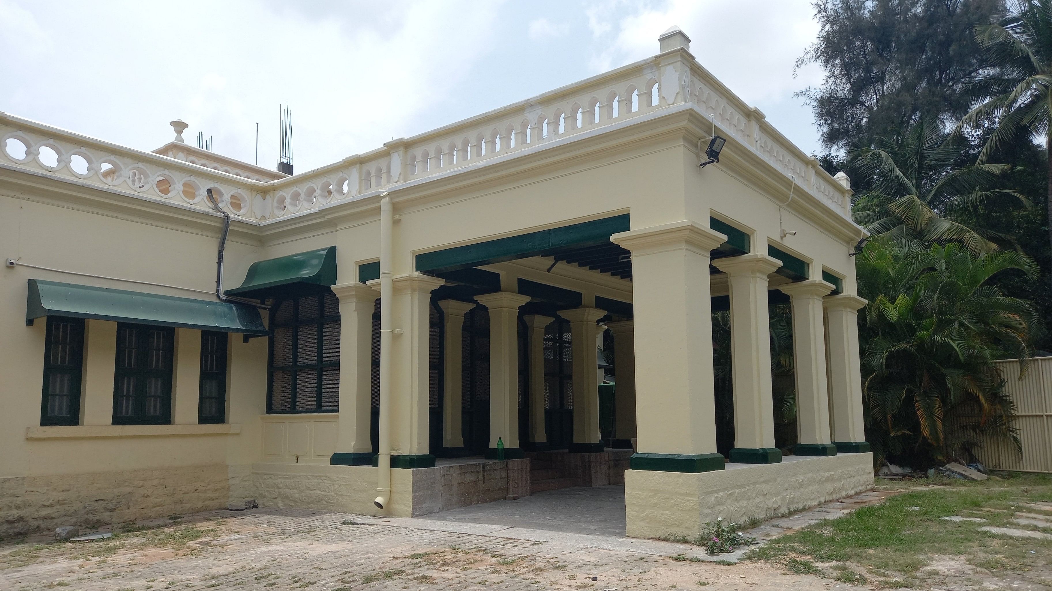 <div class="paragraphs"><p>The entrance to the Maratha boys' hostel premises; the busts of the founders. </p></div>