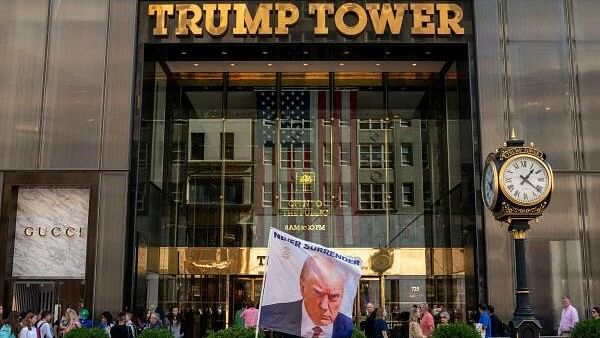 <div class="paragraphs"><p>A flag depicting former US President Donald Trump outside Trump Tower in New York City.</p></div>
