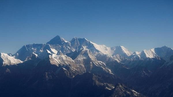 <div class="paragraphs"><p>Mount Everest, the world highest peak, and other peaks of the Himalayan range are seen through an aircraft window during a mountain flight from Kathmandu, Nepal.</p></div>