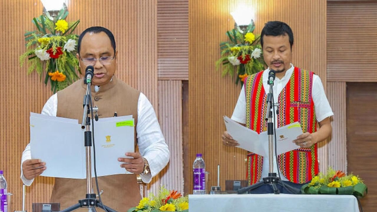 <div class="paragraphs"><p>TIPRA Motha Party MLAs Animesh Debbarma (left) and Brishaketu Debbarma (right) take oath as Tripura cabinet ministers during a ceremony, at Raj Bhavan, in Agartala, Thursday on March 7, 2024.</p></div>