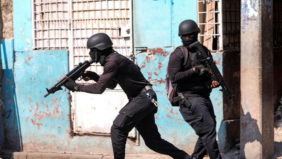 <div class="paragraphs"><p>Police officers take part in an operation on the surroundings of the National Penitentiary following a fire, as a powerful gang leader in Haiti has issued a threatening message aimed at political leaders who would take part in a still-unformed transition council for the country, in Port-au-Prince, Haiti, March 14, 2024.</p></div>
