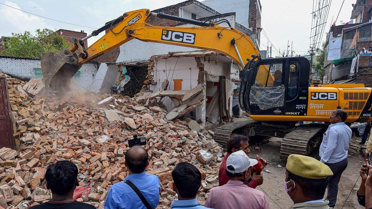 <div class="paragraphs"><p>Representative image of a house demolition using bulldozer</p></div>