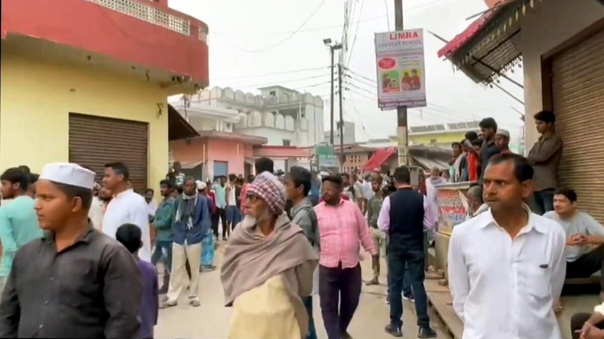 <div class="paragraphs"><p>People gather outside the residence of the jailed gangster-turned-politician Mukhtar Ansari who died of cardiac arrest in the Banda hospital.</p></div>