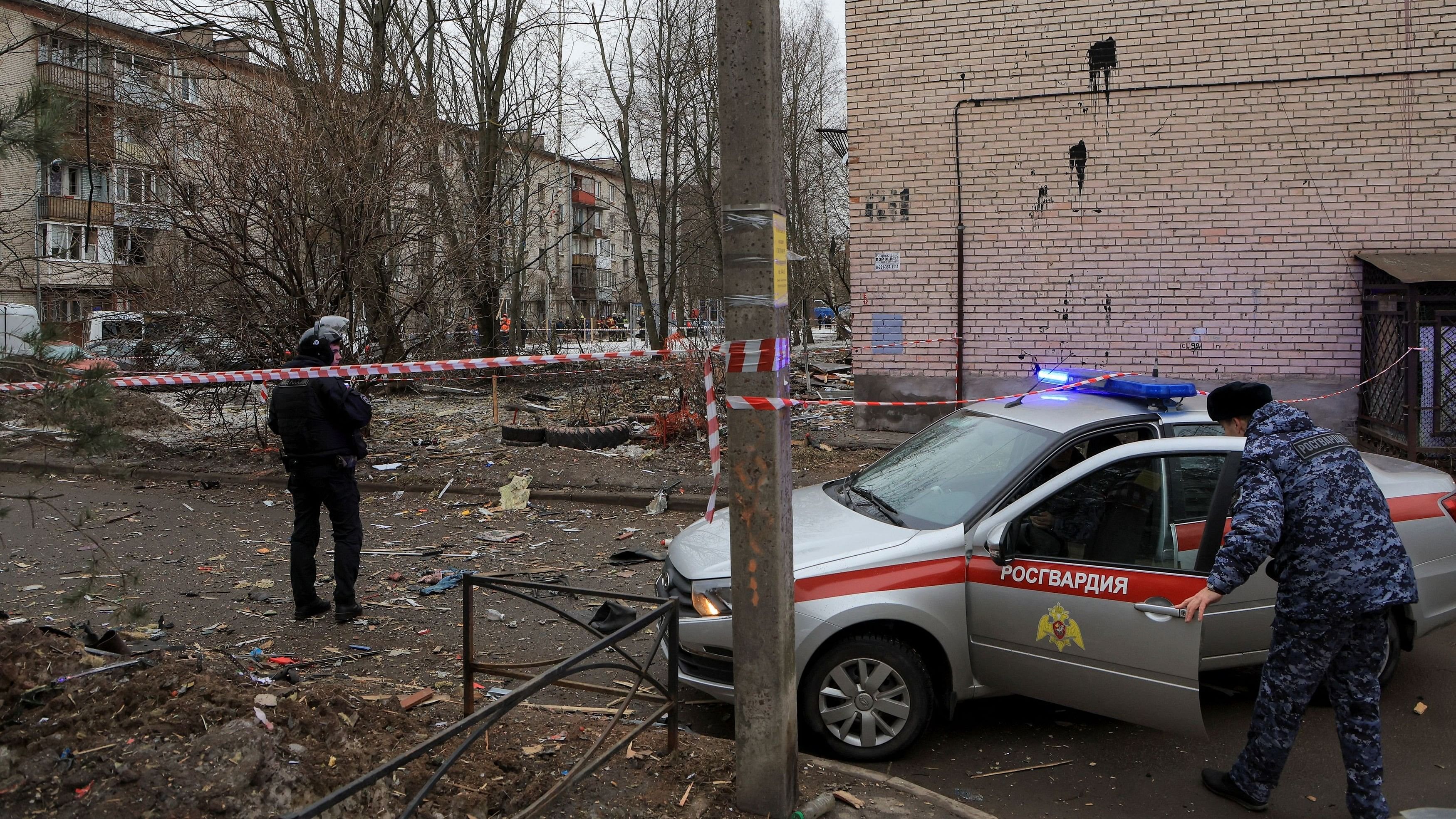 <div class="paragraphs"><p>Russian law enforcement officers work at the scene near a damaged multi-storey residential building following an alleged drone attack in Saint Petersburg, Russia, March 2, 2024.</p></div>