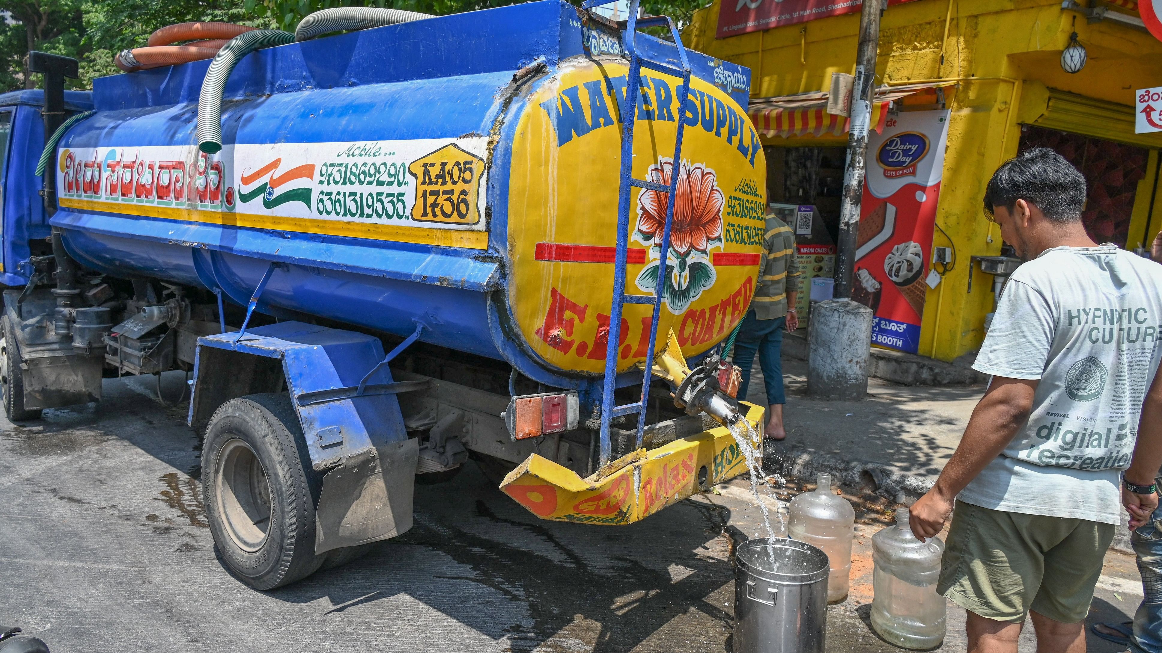 <div class="paragraphs"><p>A man collects drinking water from a tanker in&nbsp;VV Giri Colony on Saturday.&nbsp;</p></div>