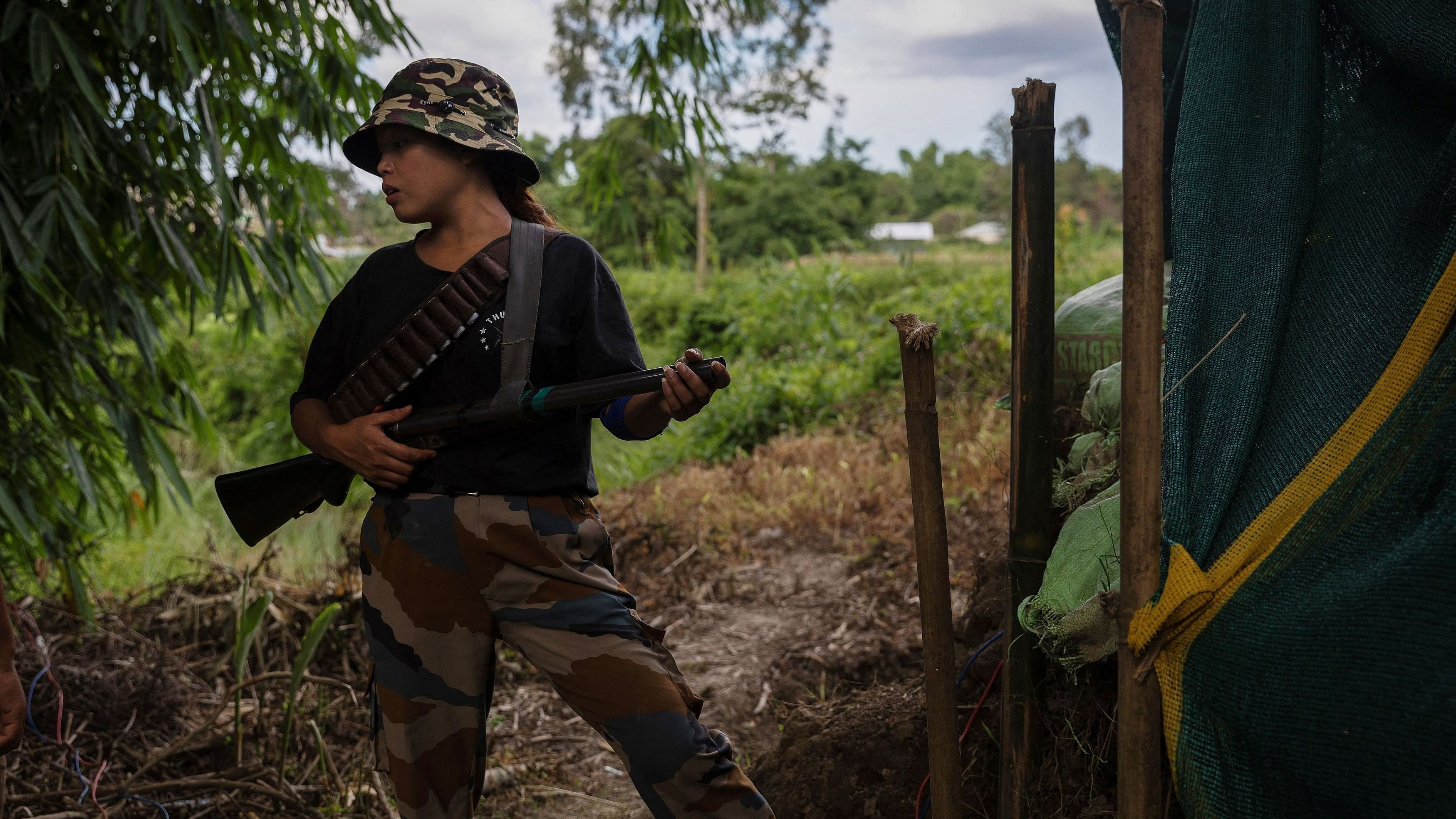 <div class="paragraphs"><p>An armed Kuki woman stands outside a bunker at a frontline village in Churachandpur district in the northeastern state of Manipur.</p></div>