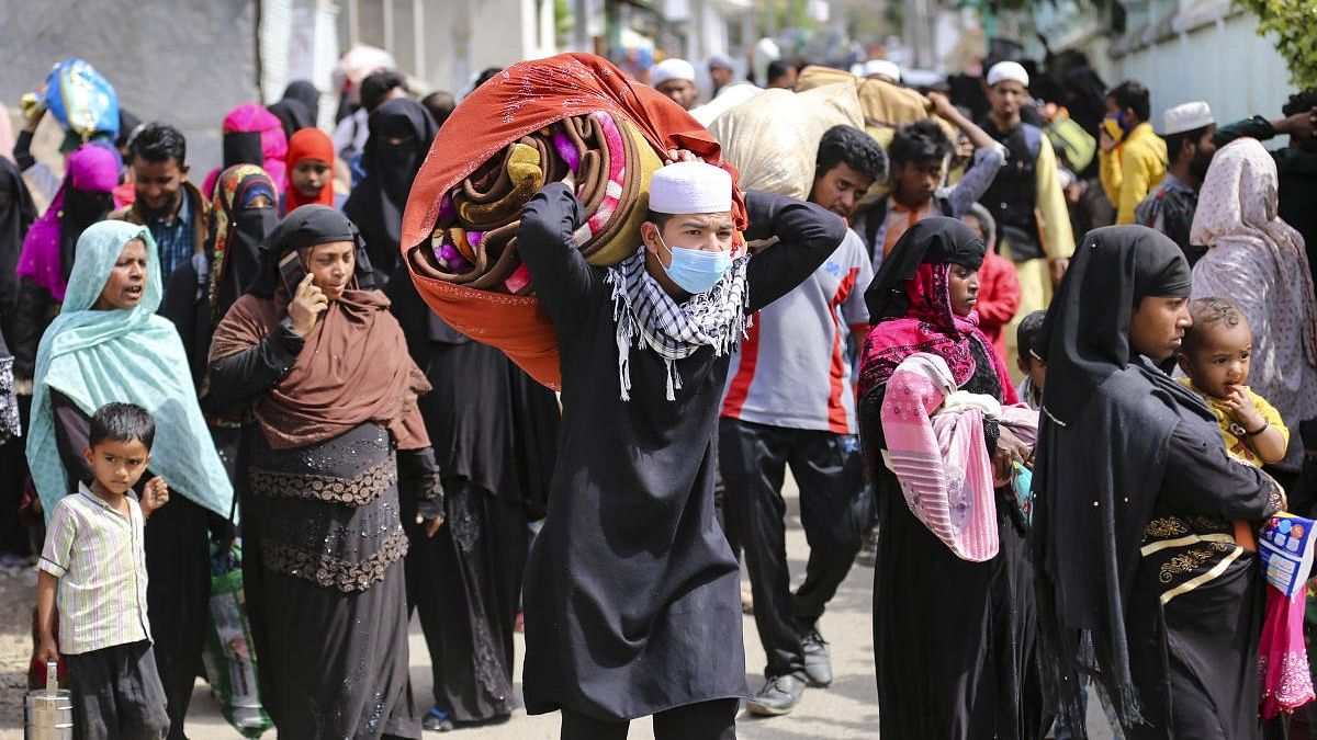 <div class="paragraphs"><p>Rohingya Muslims leave their settlement for a centre following a police verification drive, in Jammu</p></div>