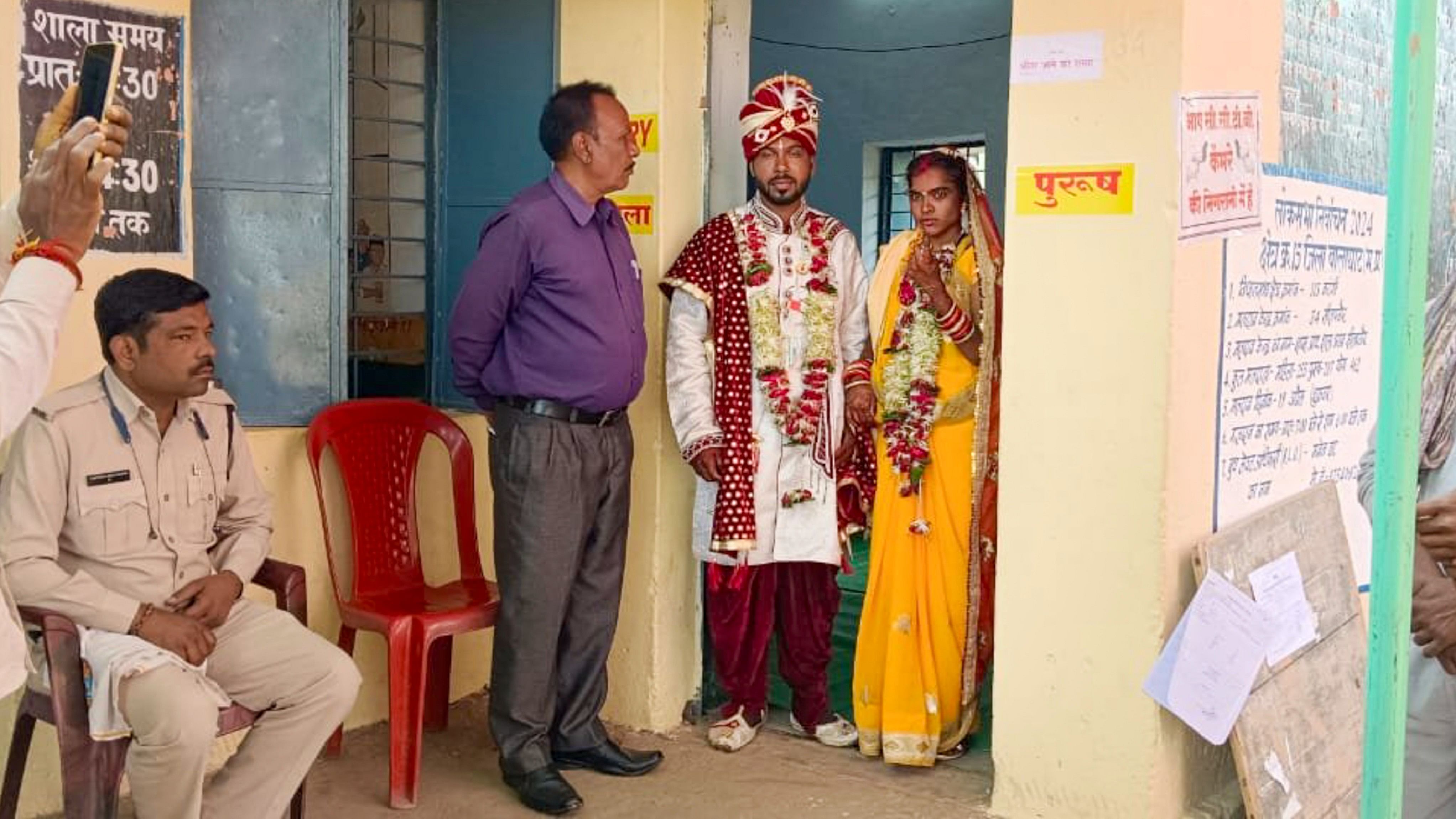 <div class="paragraphs"><p>A newly-wedded couple at a polling station after casting their votes for the first phase of Lok Sabha elections, in Balaghat district, Friday.</p></div>