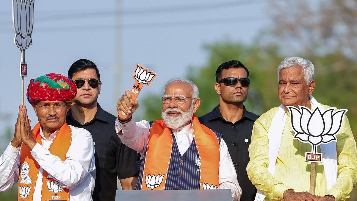 <div class="paragraphs"><p>Prime Minister Narendra Modi during a road show ahead of Lok Sabha polls in Dausa.</p></div>