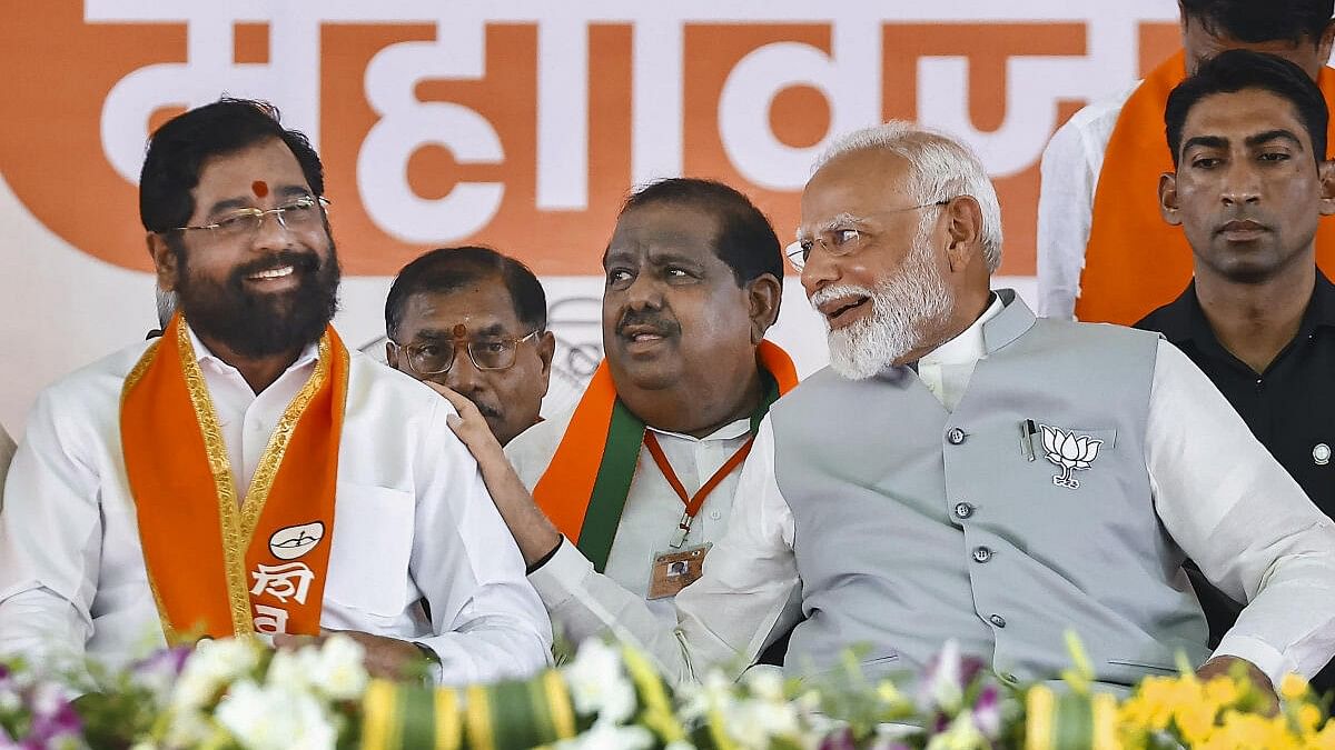 <div class="paragraphs"><p> Prime Minister Narendra Modi with Maharashtra Chief Minister Eknath Shinde during a rally for Lok Sabha polls, in Nanded, Saturday, April 20, 2024.</p></div>