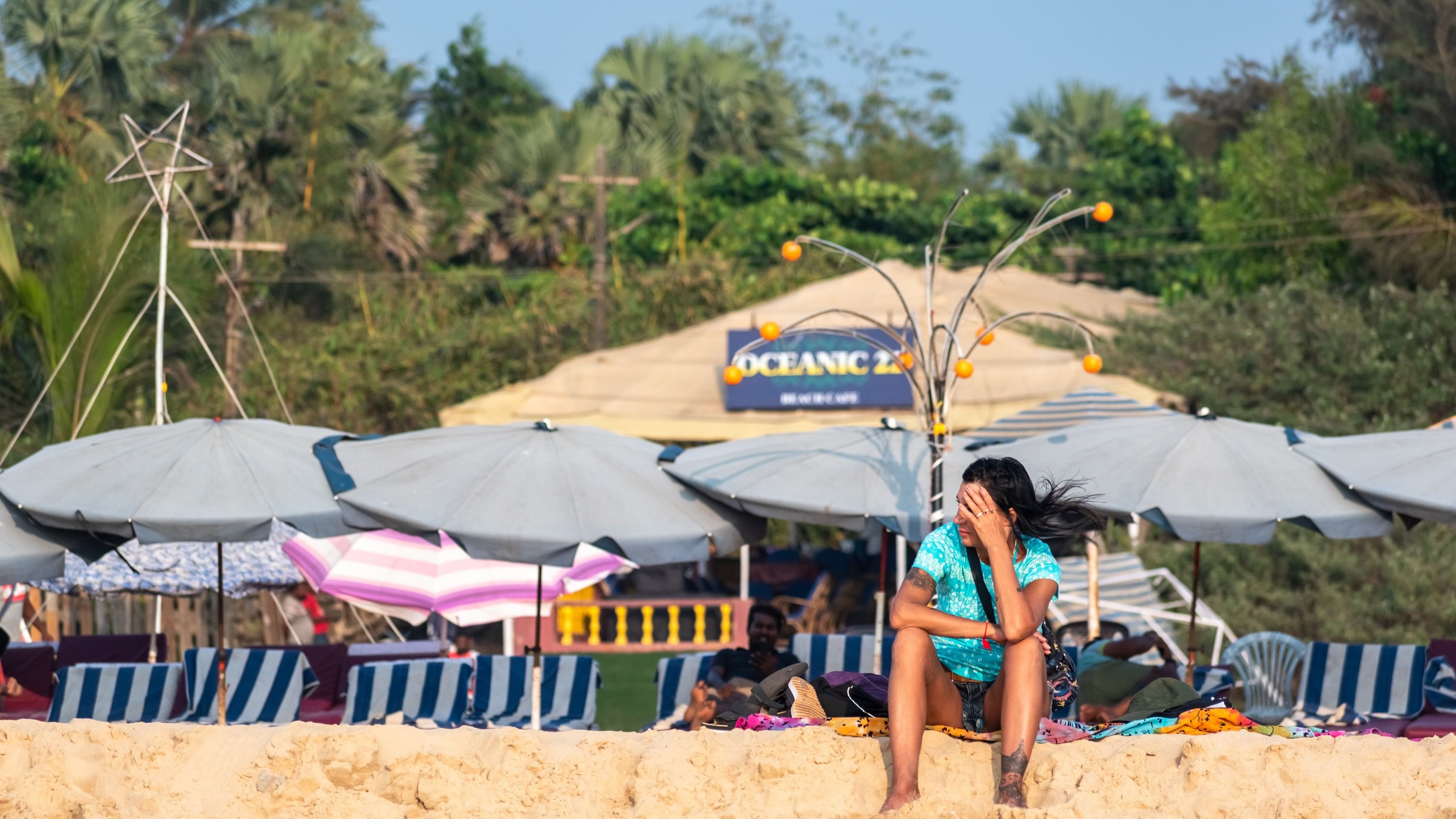 <div class="paragraphs"><p>A tourist sitting near a beach shack in Goa's Calangute (Representative image)</p></div>