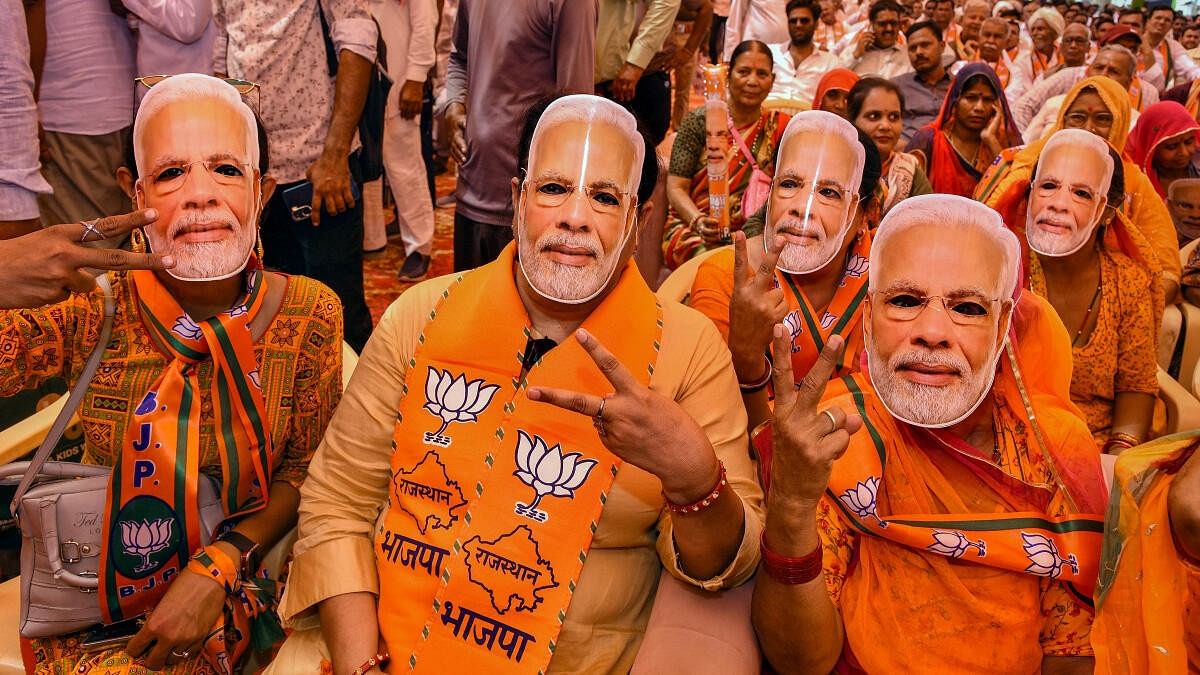 <div class="paragraphs"><p>Representative image of BJP supporters wearing masks of PM Narendra Modi.</p></div>