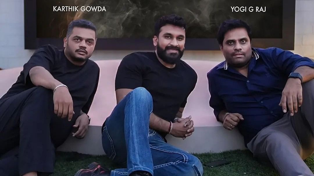 <div class="paragraphs"><p>Dheeren R Rajkumar flanked by Karthik Gowda and Yogi G Raj.</p></div>