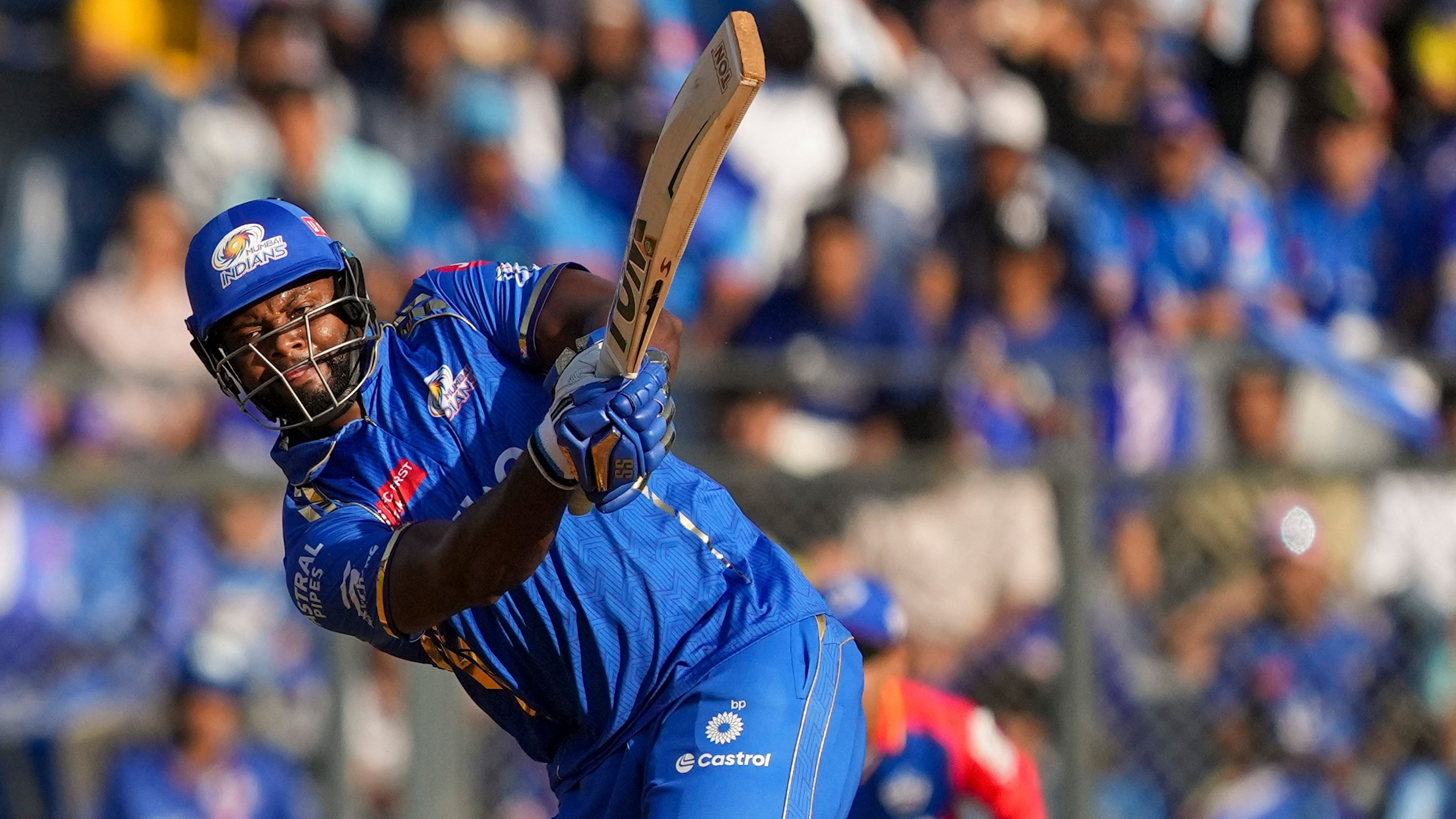 <div class="paragraphs"><p>Mumbai Indians' batter Romario Shepherd  plays a shot during the Indian Premier League (IPL) cricket match between Delhi Capitals and Mumbai Indians, at Wankhede Staduim, in Mumbai, Sunday, April 7, 2024.</p></div>