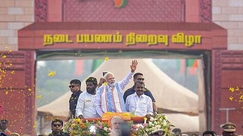 <div class="paragraphs"><p>Prime Minister Narendra Modi with Tamil Nadu BJP President K Annamalai during a roadshow.</p></div>