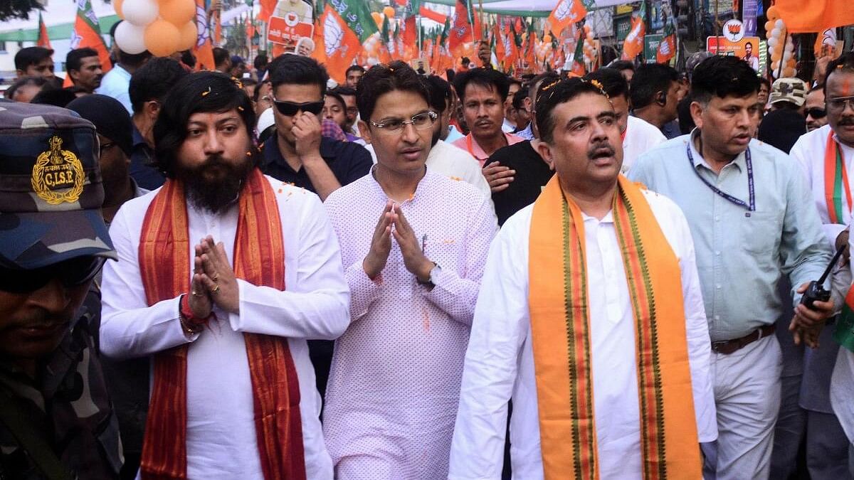 <div class="paragraphs"><p>Union minister Nisith Pramanik and LoP in West Bengal Assembly Suvendu Adhikari with BJP candidate from Darjeeling constituency Raju Bista  in Siliguri.</p></div>