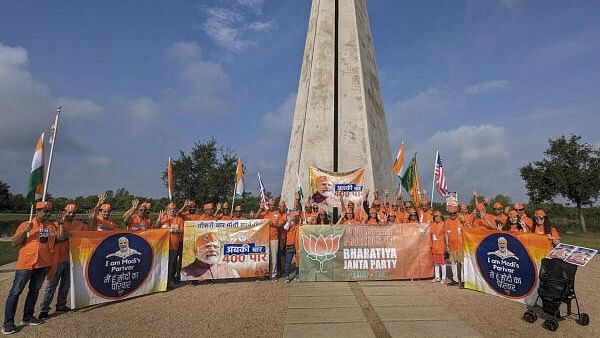 <div class="paragraphs"><p>Members and supporters of the Overseas Friends of BJP take part in a rally in support of Prime Minister Narendra Modi ahead of upcoming Lok Sabha elections in India, in USA.</p></div>