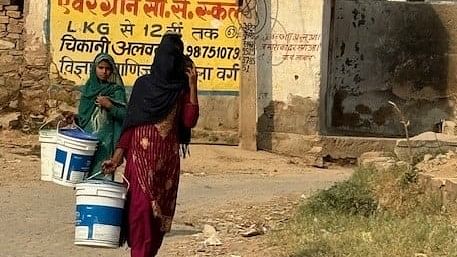 <div class="paragraphs"><p>Saifeena and her elder sister trudge 6 km every day to get water for their family in Jajore village in Alwar&nbsp;constituency. </p></div>