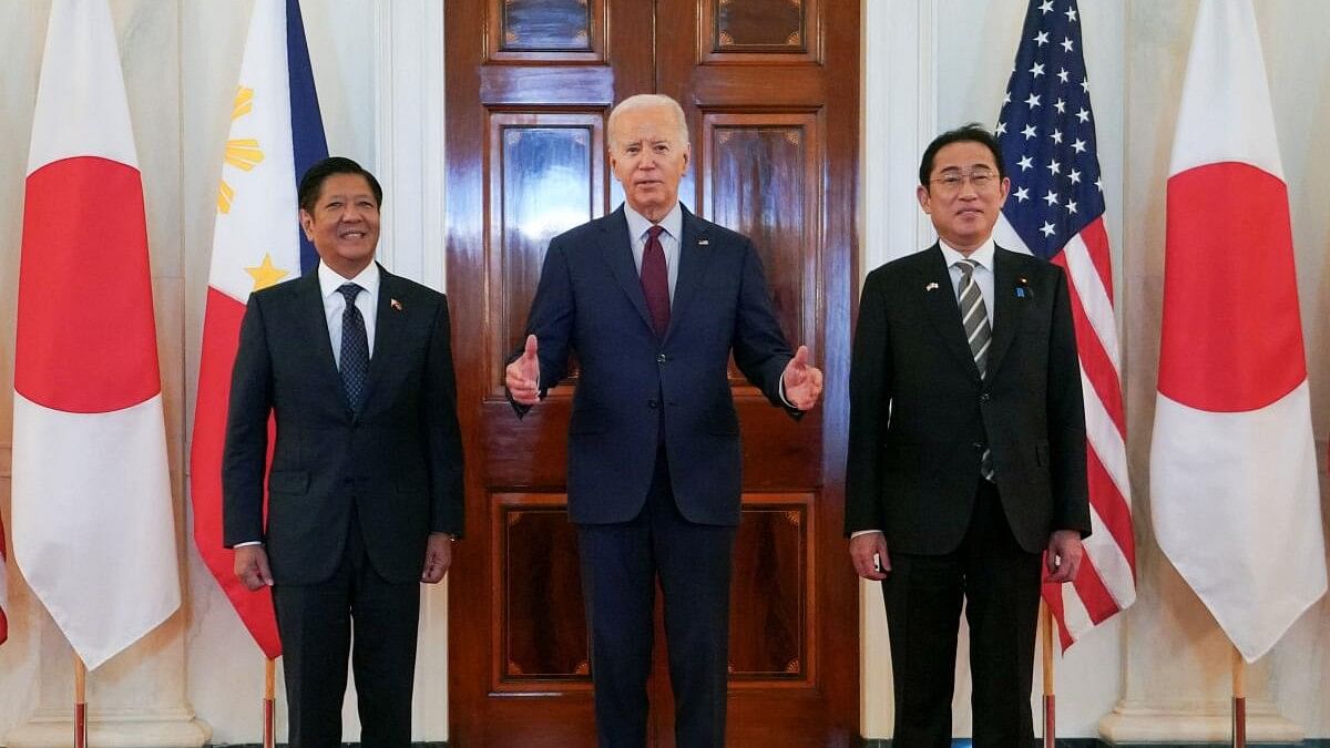 <div class="paragraphs"><p>US President Joe Biden speaks while escorting Philippines President Ferdinand Marcos Jr and Japan Prime Minister Fumio Kishida to their trilateral summit at the White House in Washington</p></div>