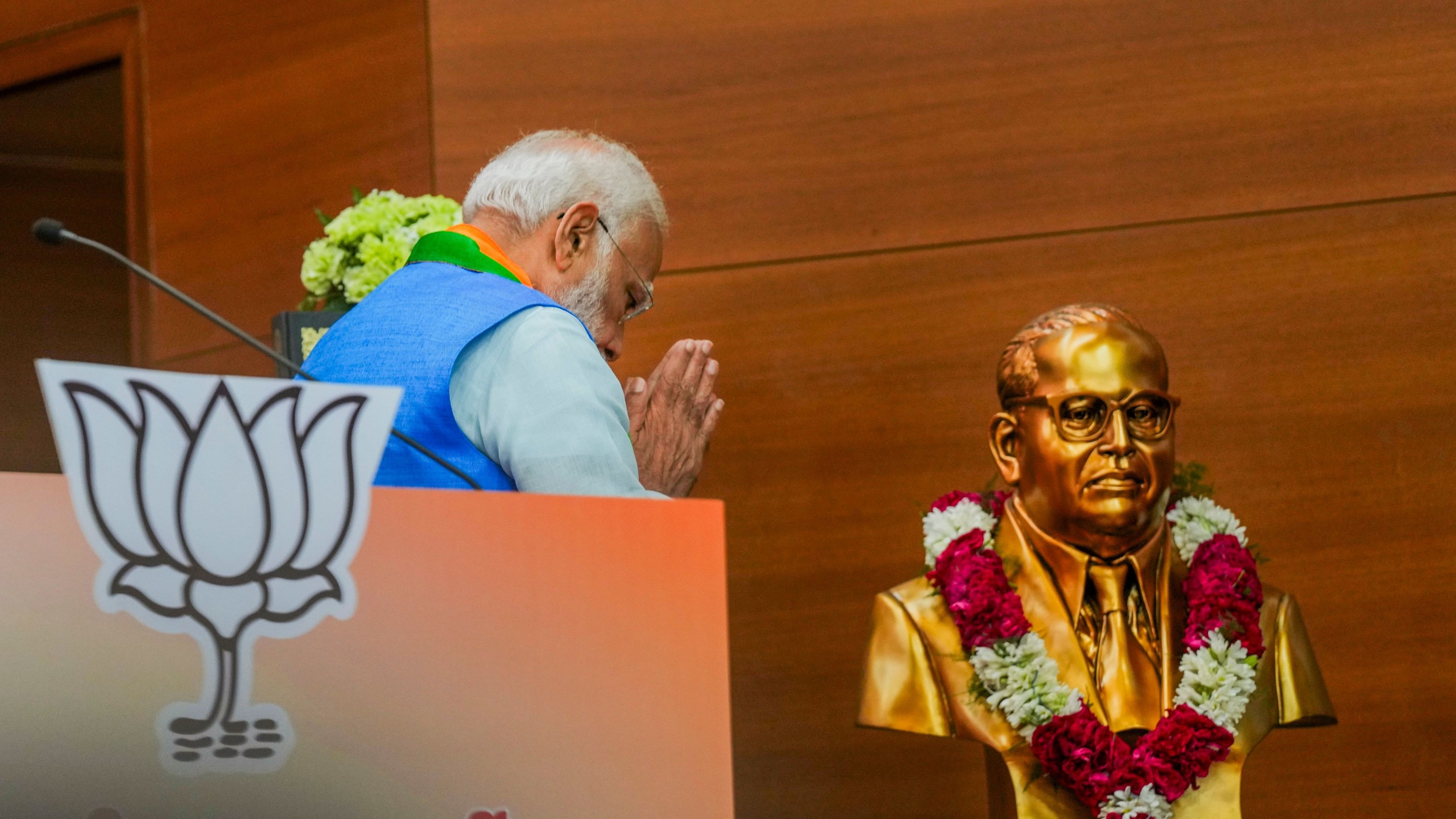 <div class="paragraphs"><p> Prime Minister Narendra Modi pays tribute to BR Ambedkar during the release of the party's election manifesto Sankalp Patra at the party headquarters.</p></div>