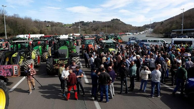 <div class="paragraphs"><p>French and Spanish farmers block the motorway border between France and Spain during a protest over price pressures, taxes and green regulation, grievances shared by farmers.</p></div>