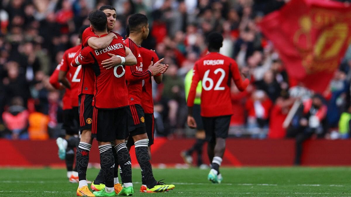 <div class="paragraphs"><p>Manchester United players Diogo Dalot and Bruno Fernandes celebrate after the win against Coventry</p></div>