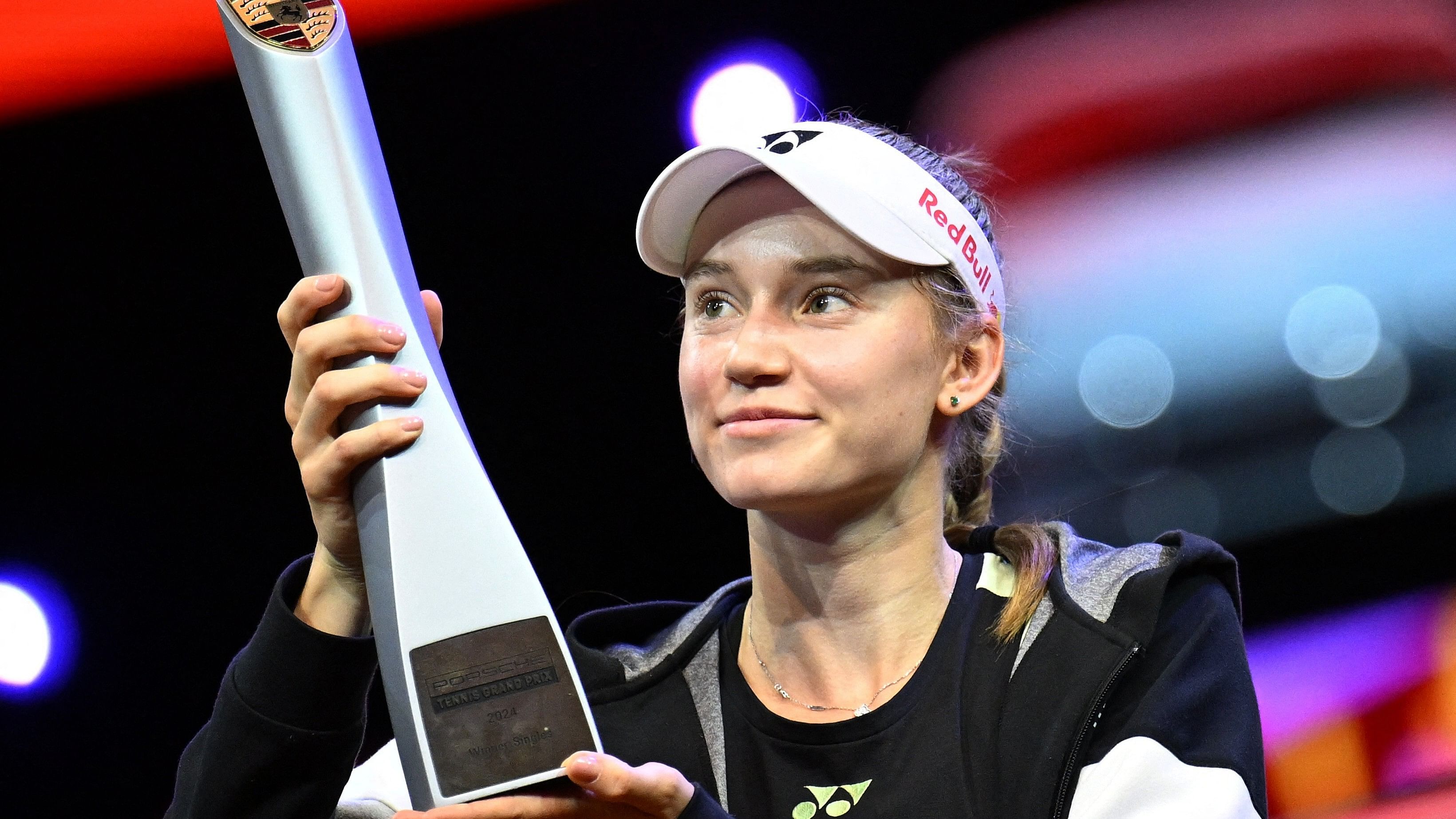 <div class="paragraphs"><p>Kazakhstan's Elena Rybakina celebrates with the trophy after winning her final match against Ukraine's Marta Kostyuk</p></div>