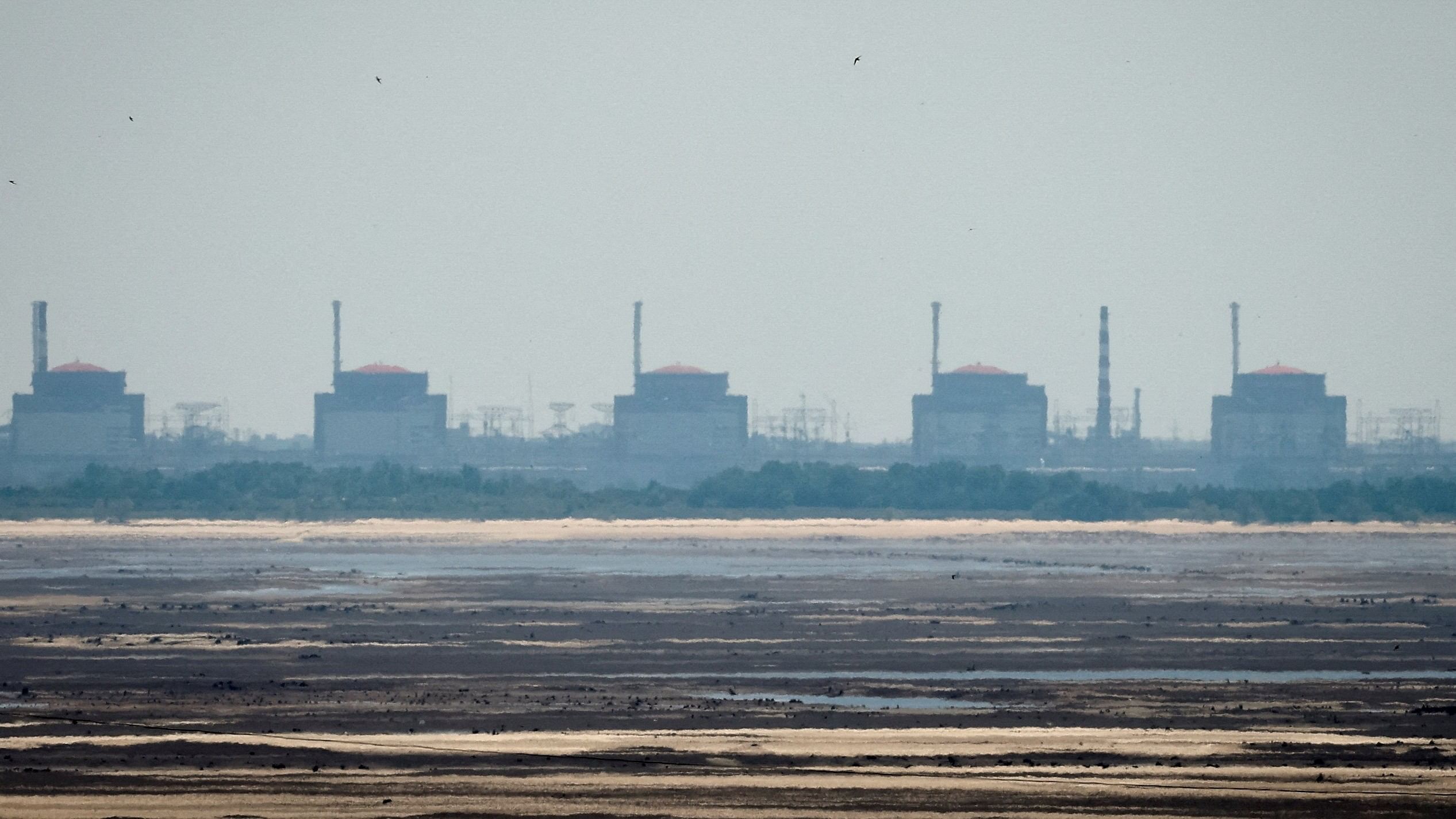 <div class="paragraphs"><p>FILE PHOTO: A view shows Zaporizhzhia Nuclear Power Plant from the bank of Kakhovka Reservoir near the town of Nikopol, in Dnipropetrovsk region, Ukraine, June 16, 2023.o</p></div>