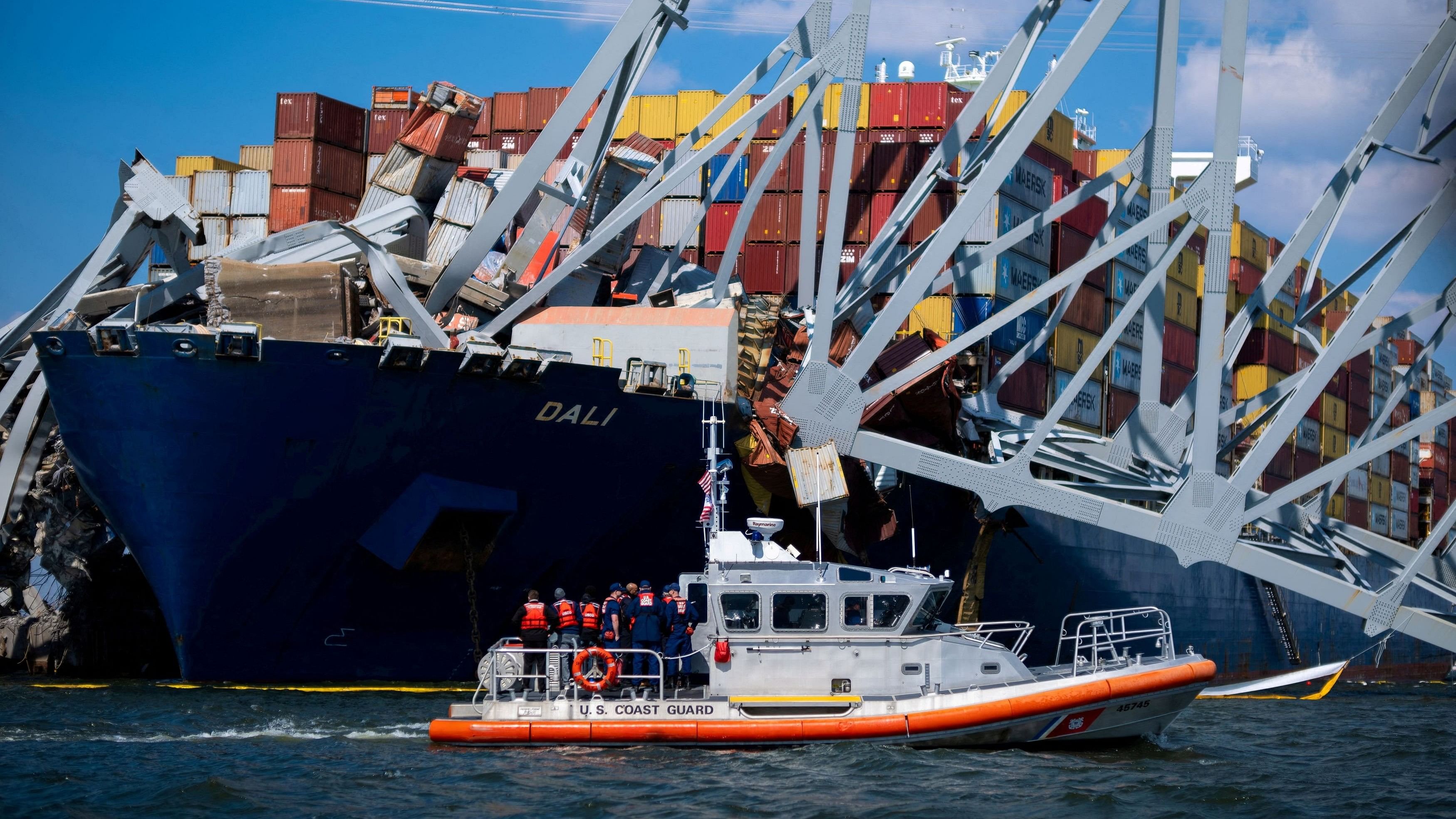 <div class="paragraphs"><p>  A Coast Guard boat carrying senior officers to assess the Francis Scott Key Bridge collapse passes the Singapore-flagged cargo ship Dali in Baltimore, Maryland, US, March 29, 2024.</p></div>