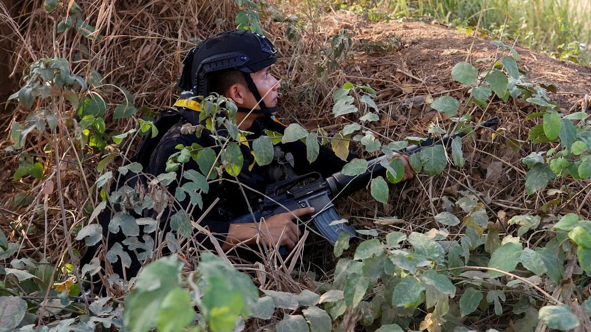 <div class="paragraphs"><p>A Thai soldier takes cover near the 2nd Thailand-Myanmar Friendship Bridge during fighting on the Myanmar side between the Karen National Liberation Army (KNLA) and Myanmar's troops, which continues near the Thailand-Myanmar border, in Mae Sot, Tak Province, Thailand.</p></div>