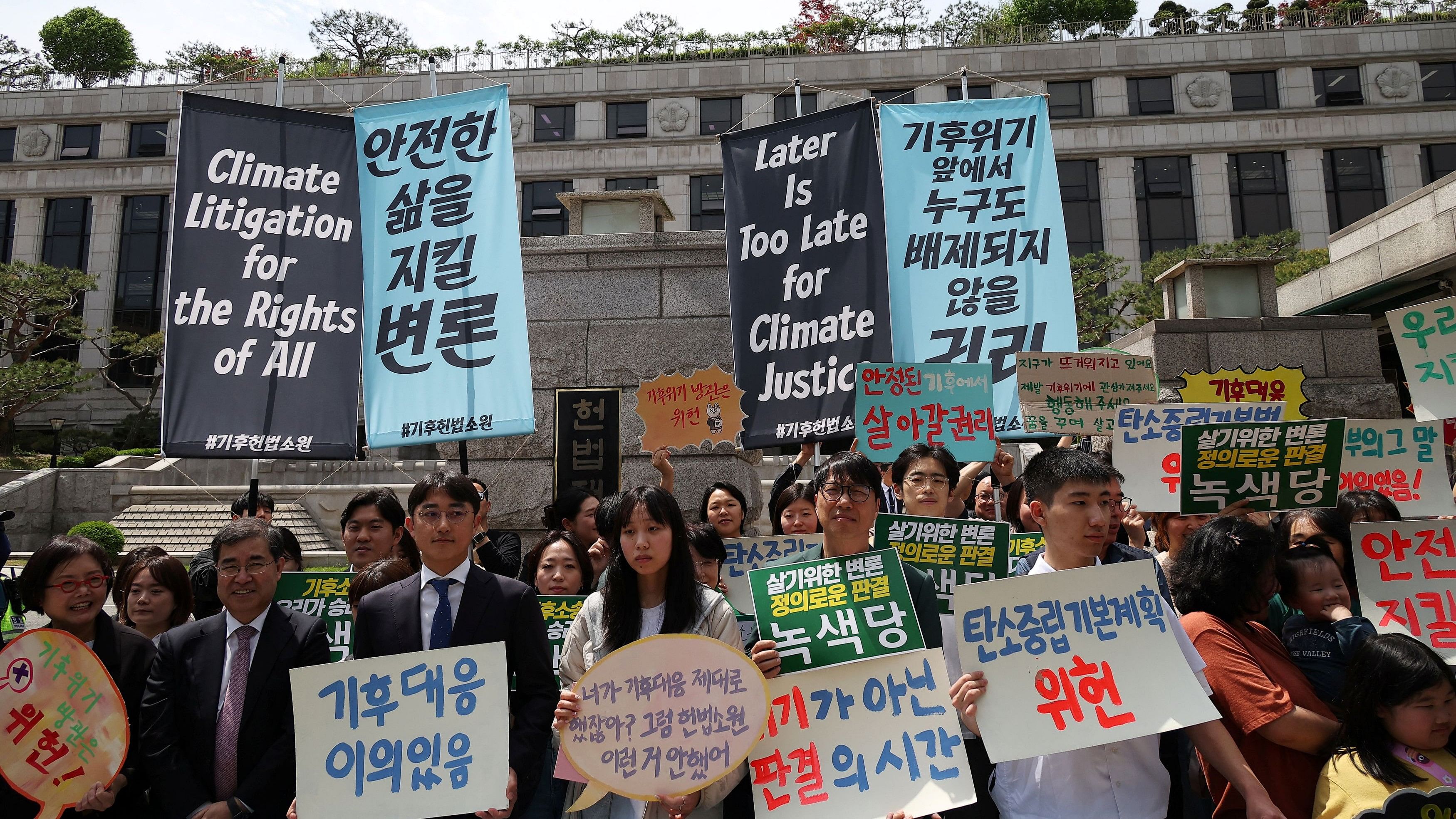 <div class="paragraphs"><p>Environmental activists chant slogans before the initial hearing for petitions filed by activists saying that the government has violated their human rights for failing to adequately address climate change, in front of the constitutional court in Seoul, South Korea, April 23, 2024.</p></div>