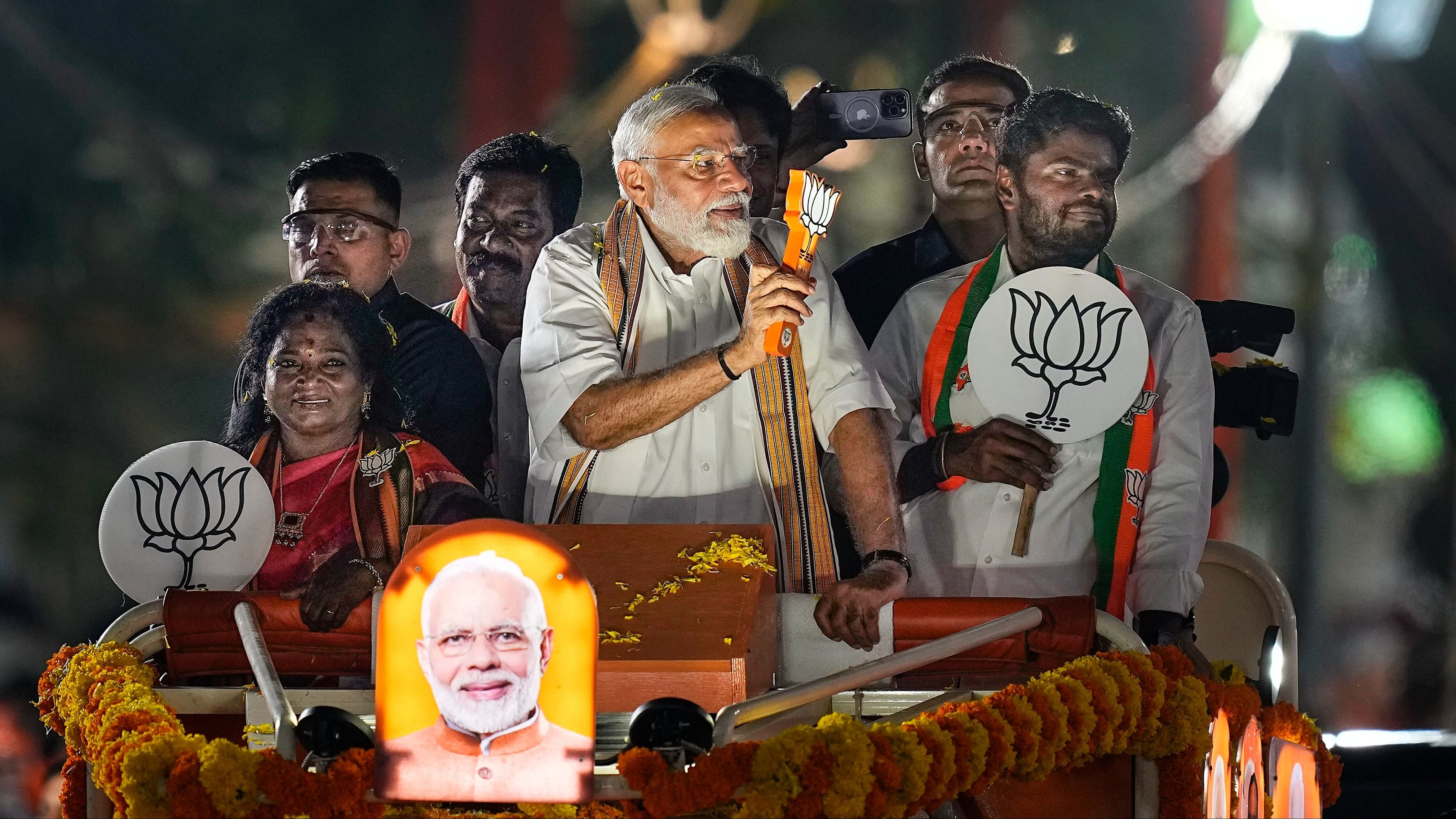 <div class="paragraphs"><p>Prime Minister Narendra Modi greets supporters during a roadshow in support of BJP's candidate from South Chennai constituency Tamilisai Soundararajan, ahead of the Lok Sabha election, in Chennai, Tuesday.</p></div>