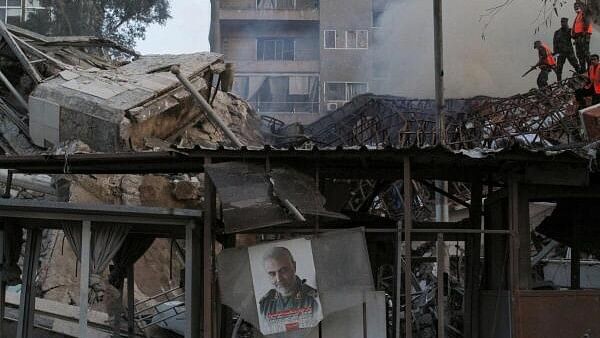 <div class="paragraphs"><p>A picture of late senior Iranian military commander General Qassem Soleimani hangs amid rubble after what Syrian and Iranian media described as an Israeli air strike on Iran's consulate in the Syrian capital Damascus.</p></div>