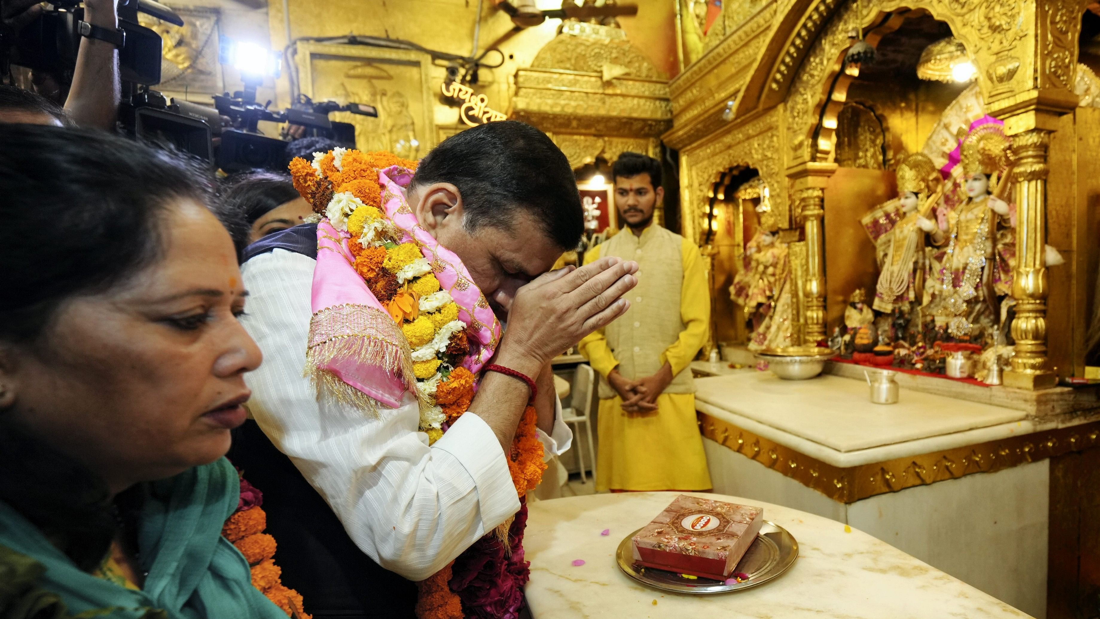 <div class="paragraphs"><p>New Delhi: AAP MP Sanjay Singh with wife Anita Singh offers prayers at Hanuman Mandir, a day after he was released from the Tihar Jail following a Supreme Court order granting him bail in the Delhi excise policy case, in New Delhi, Thursday, April 4, 2024.</p></div>