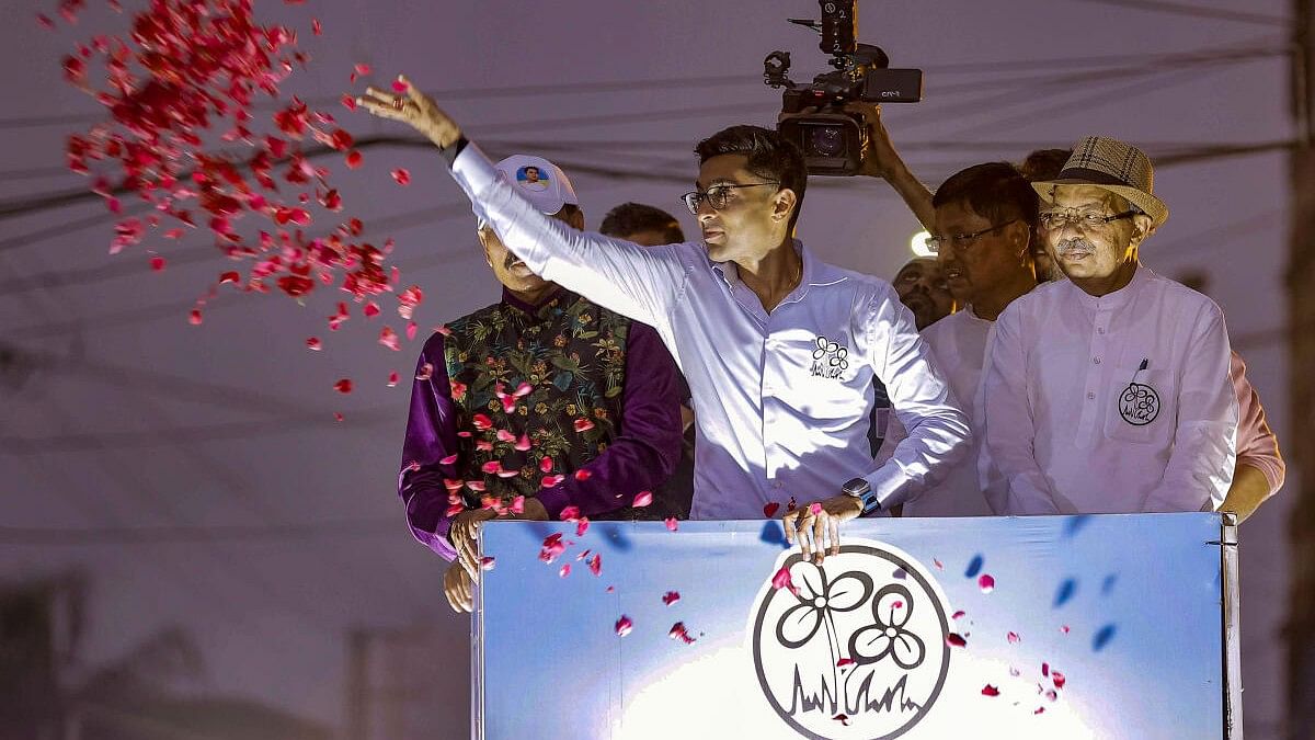 <div class="paragraphs"><p>Abhishek Banerjee (left) during a rally in support of party's candidate from Howrah  Prasun Banerjee in Howrah.</p></div>