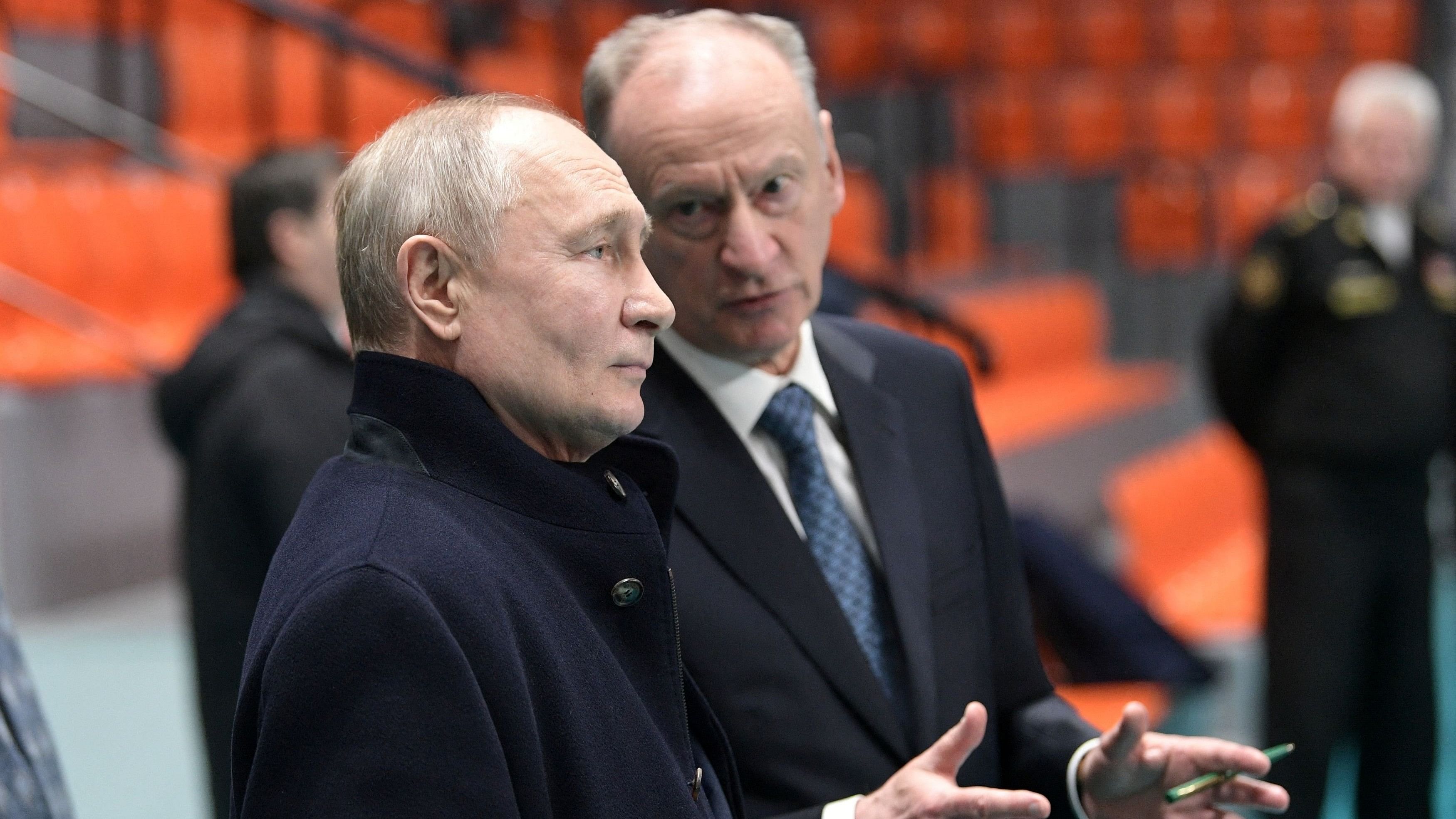 <div class="paragraphs"><p>Russian President Vladimir Putin listens to Security Council's Secretary Nikolai Patrushev.</p></div>