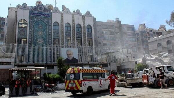 <div class="paragraphs"><p>An ambulance is parked outside the Iranian embassy after a suspected Israeli strike on  Iran's consulate, adjacent to the main Iranian embassy building, which killed seven military personnel including two key figures in the Quds Force, in the Syrian capital Damascus, Syria.</p></div>