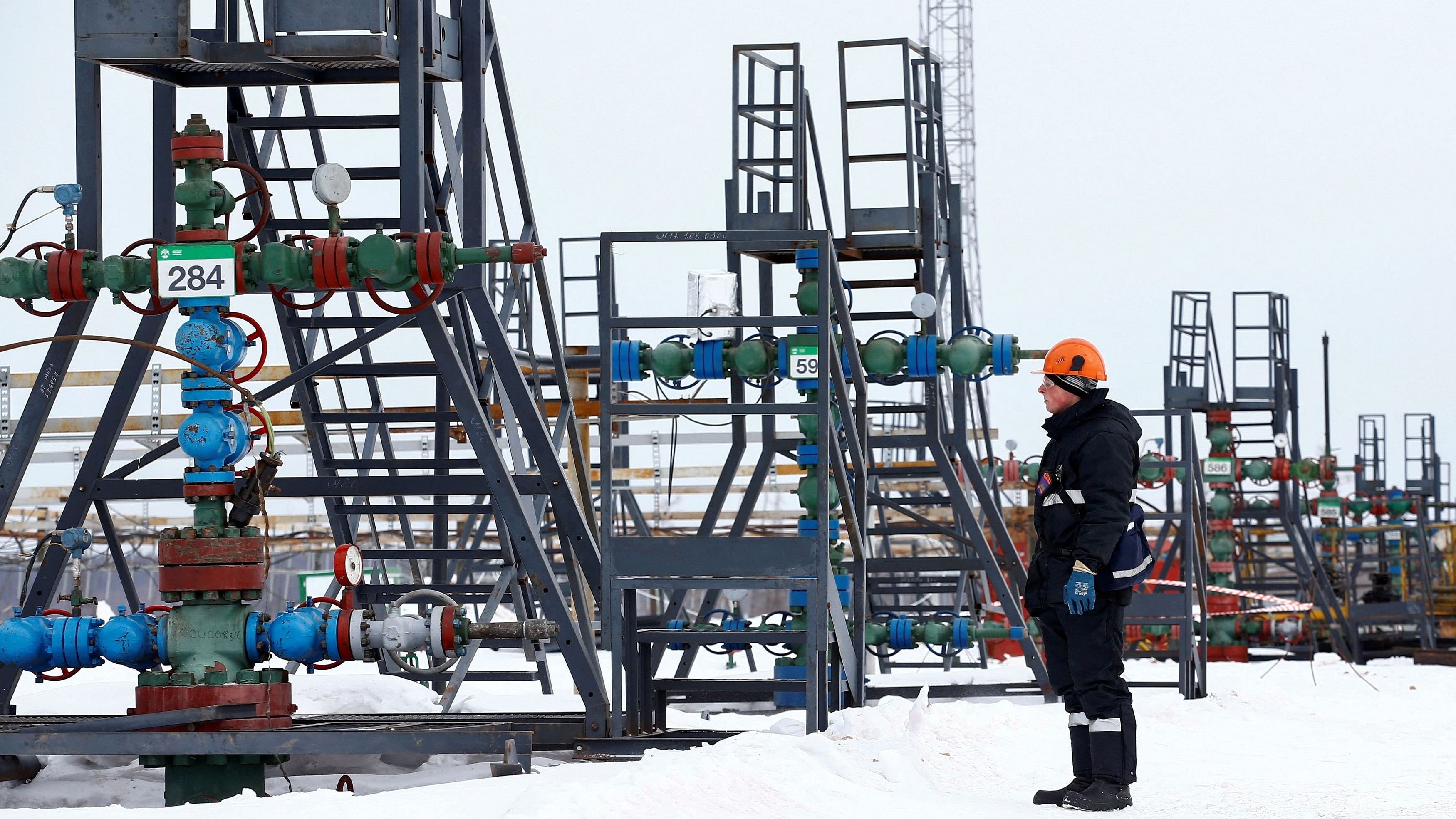 <div class="paragraphs"><p>An employee inspects a well head in the Yarakta Oil Field in Irkutsk Region, Russia. Representative image.</p></div>